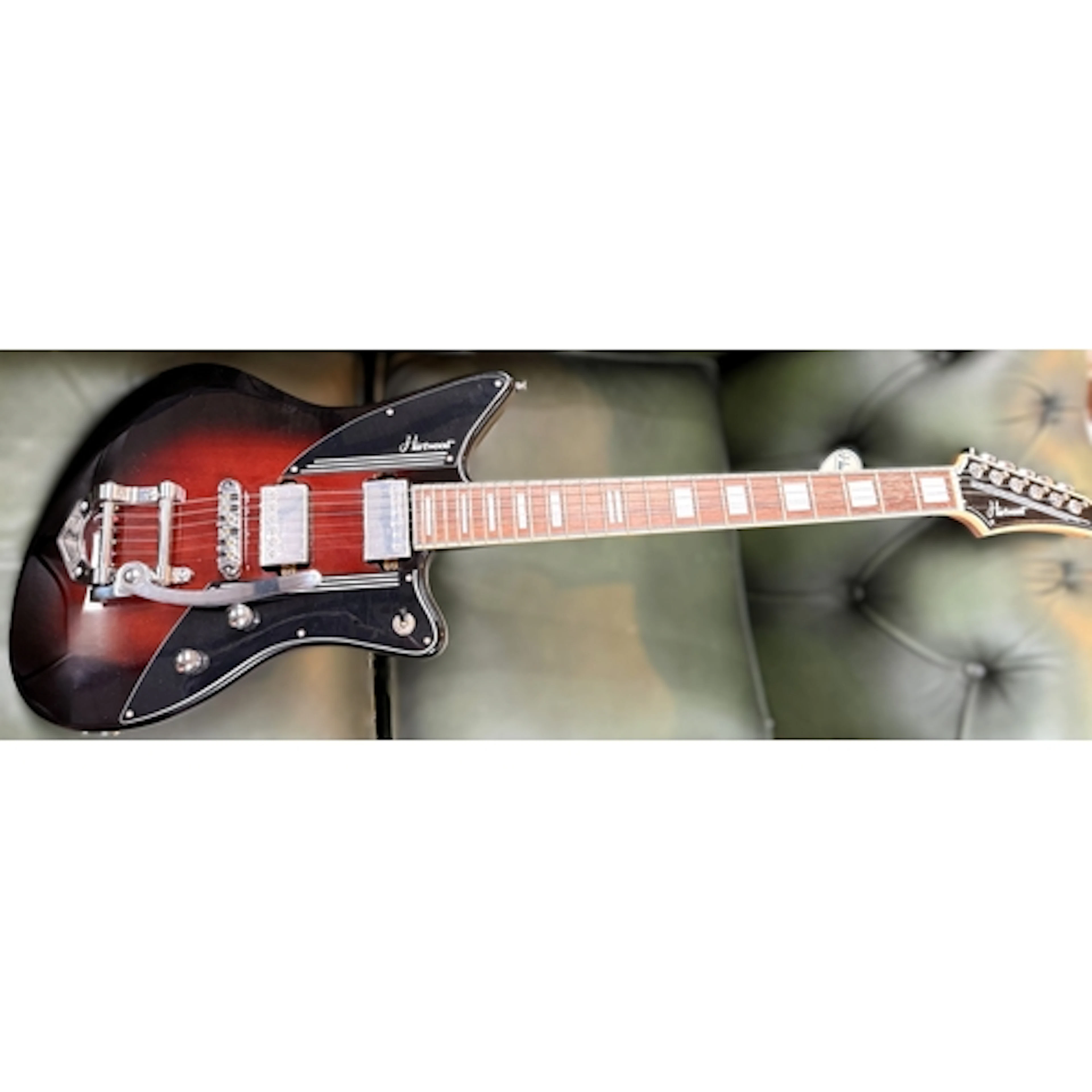 A Hartwood Charger Vibrato electric guitar in cigar burst gl...