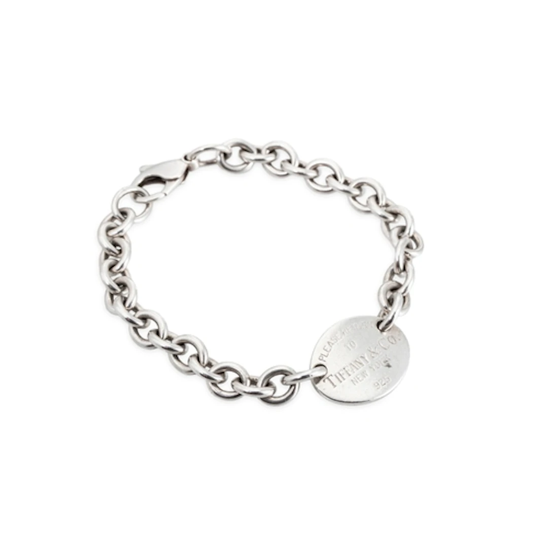 A SILVER TIFFANY BRACELET, with a return to Tiffany tag, pou...