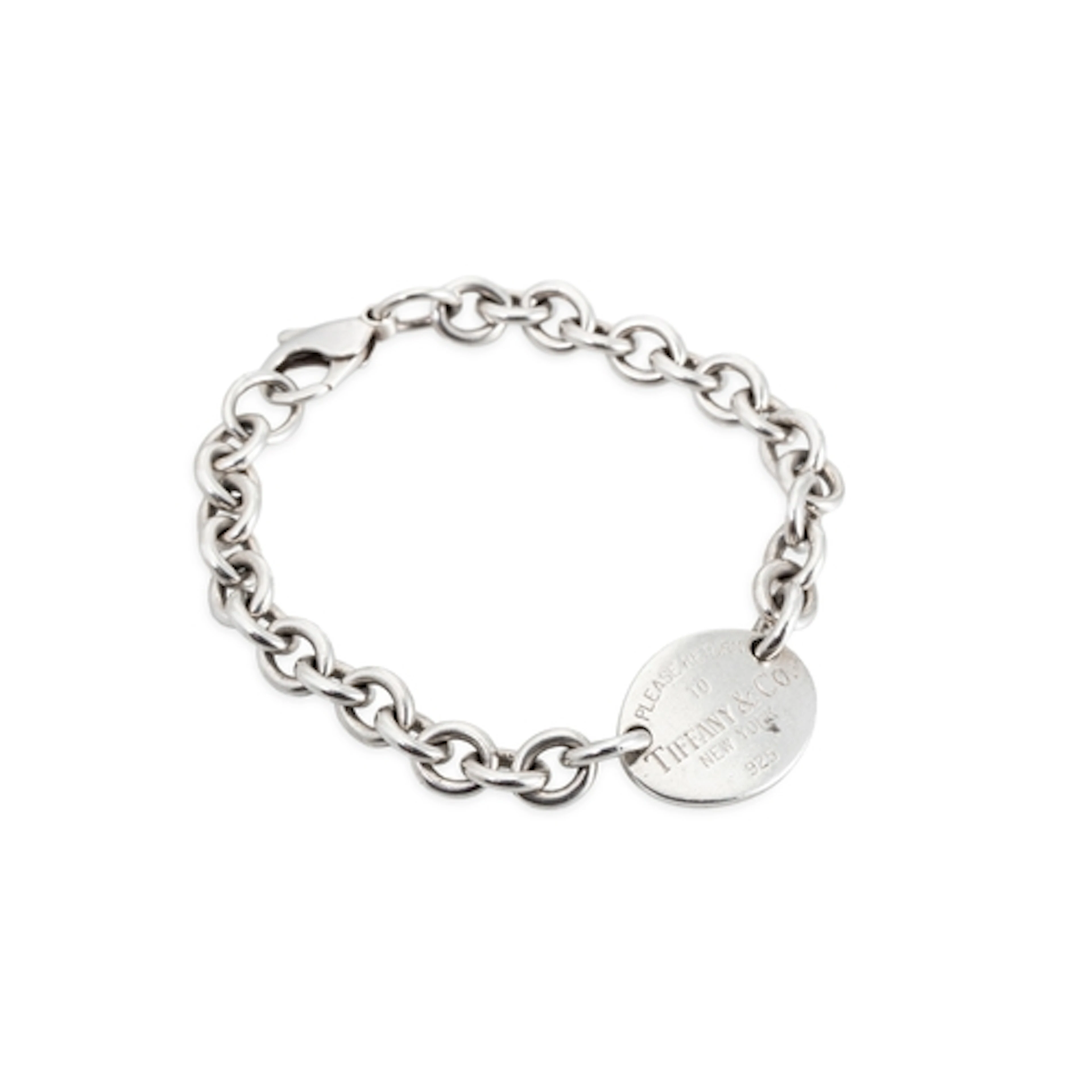 A SILVER TIFFANY BRACELET, with a return to Tiffany tag, pou...