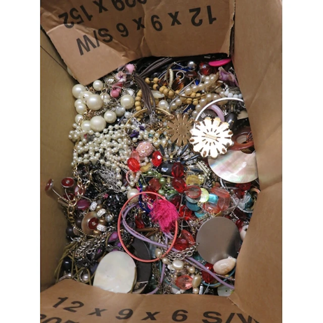 Five boxes containing a quantity of various costume jeweller...