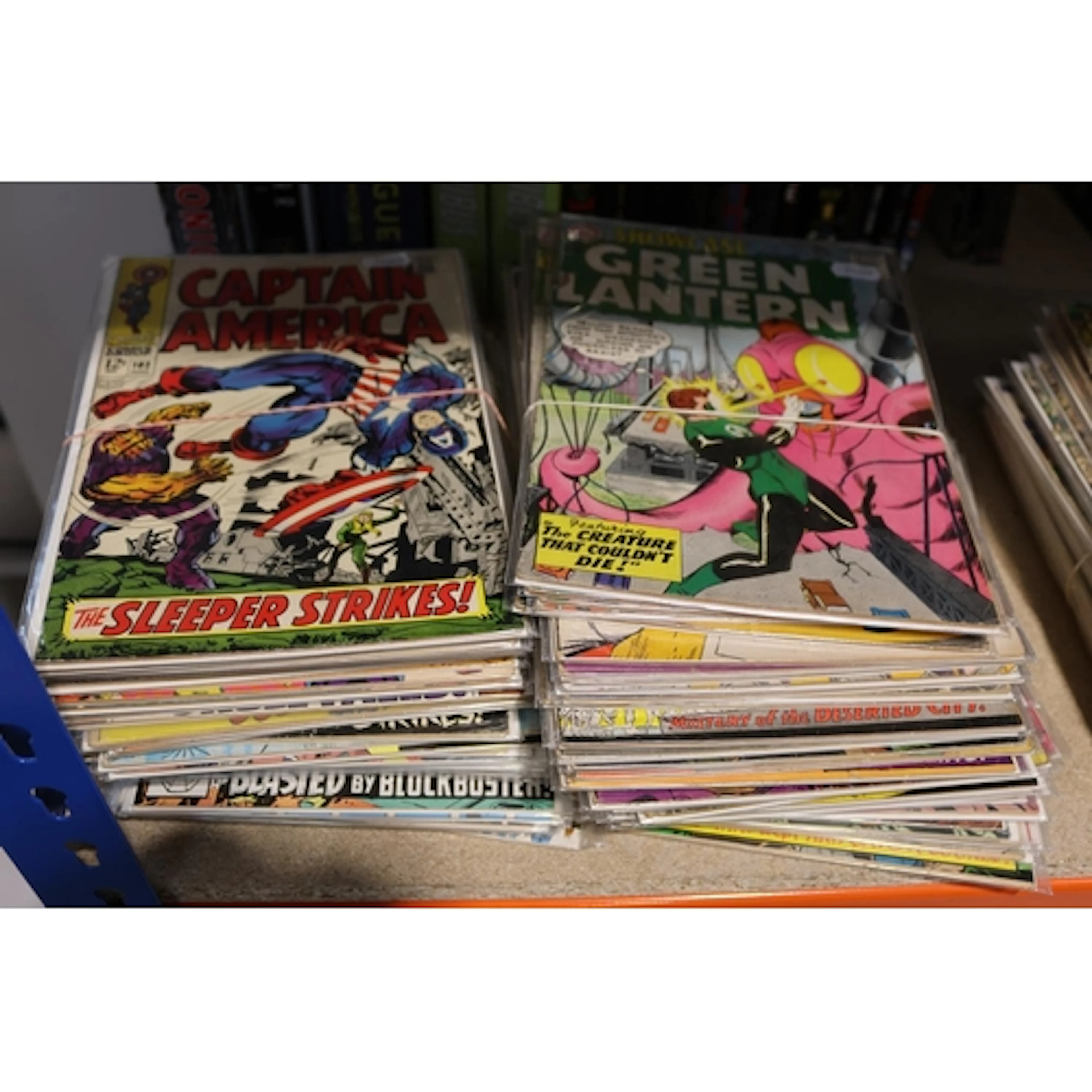 Vintage Captain America and Green Lantern comics.
