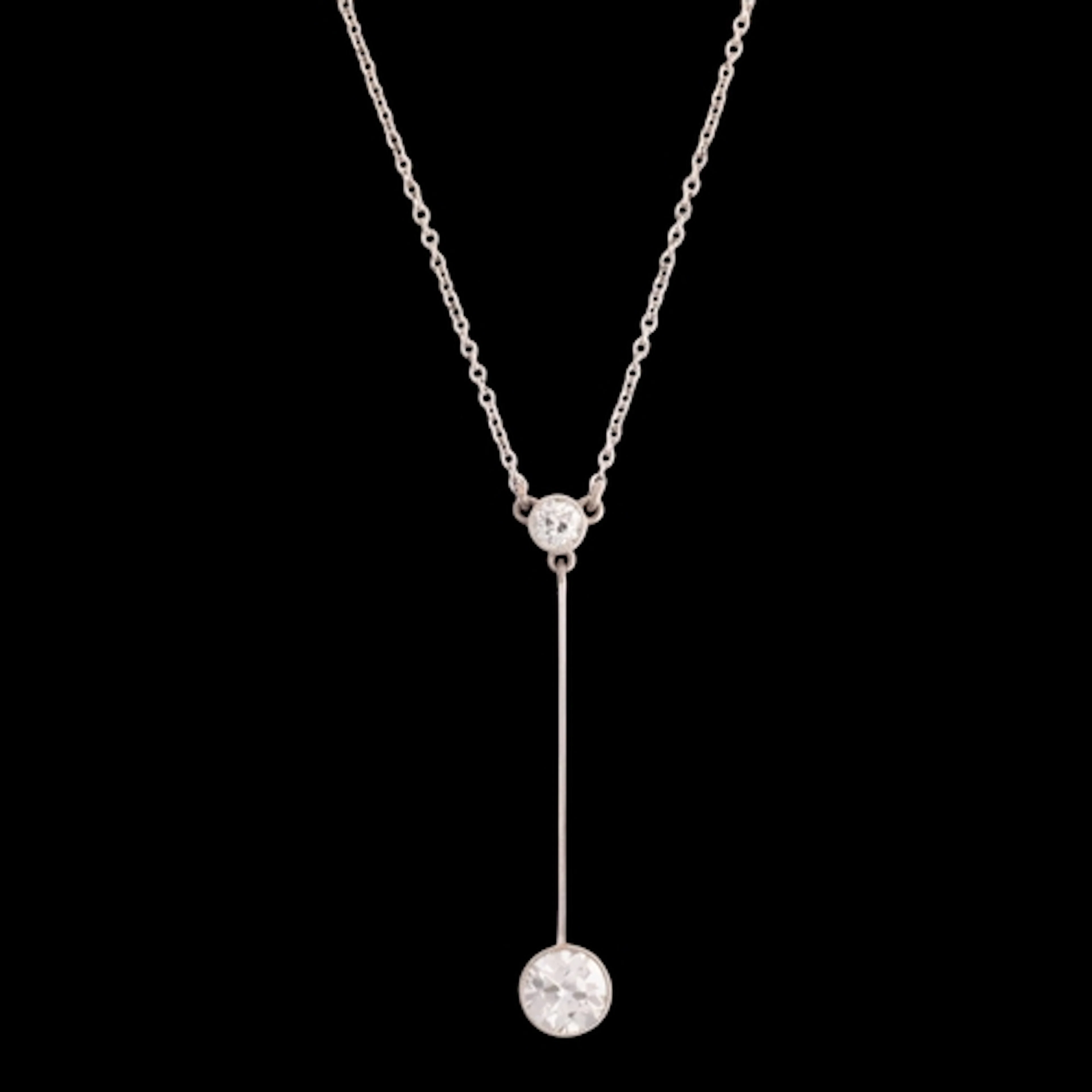 An Edwardian palladium and platinum two stone diamond pendan...