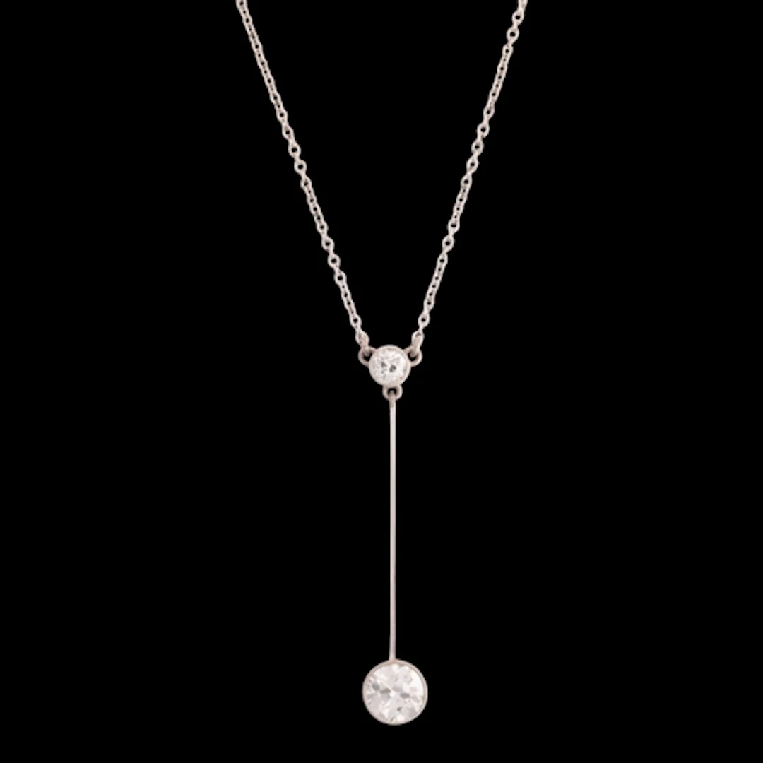 An Edwardian palladium and platinum two stone diamond pendan...