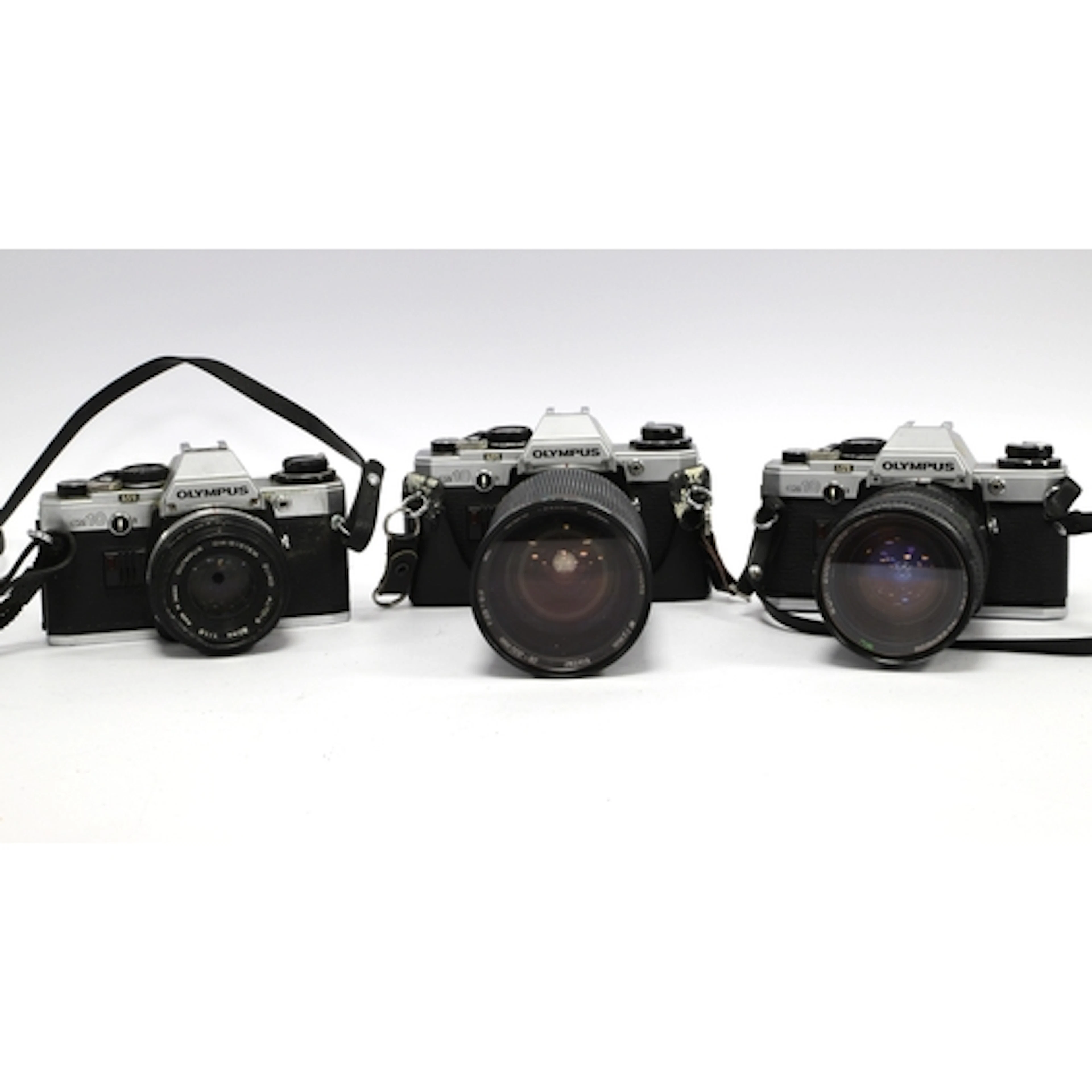 Olympus OM10 35mm SLR Film Cameras one with attached Zuiko A...