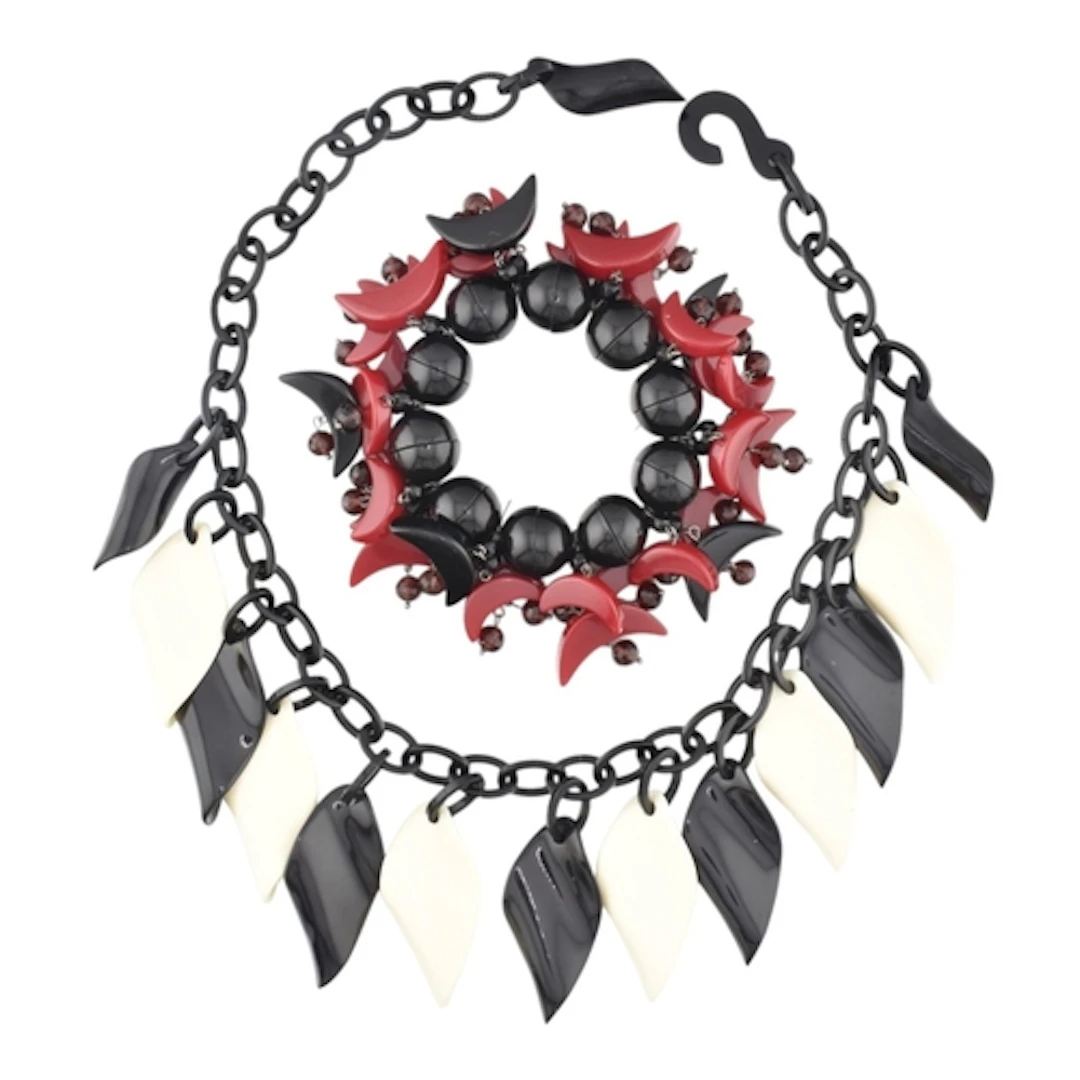 A vintage plastic bracelet & necklace. The stretch Mac M...
