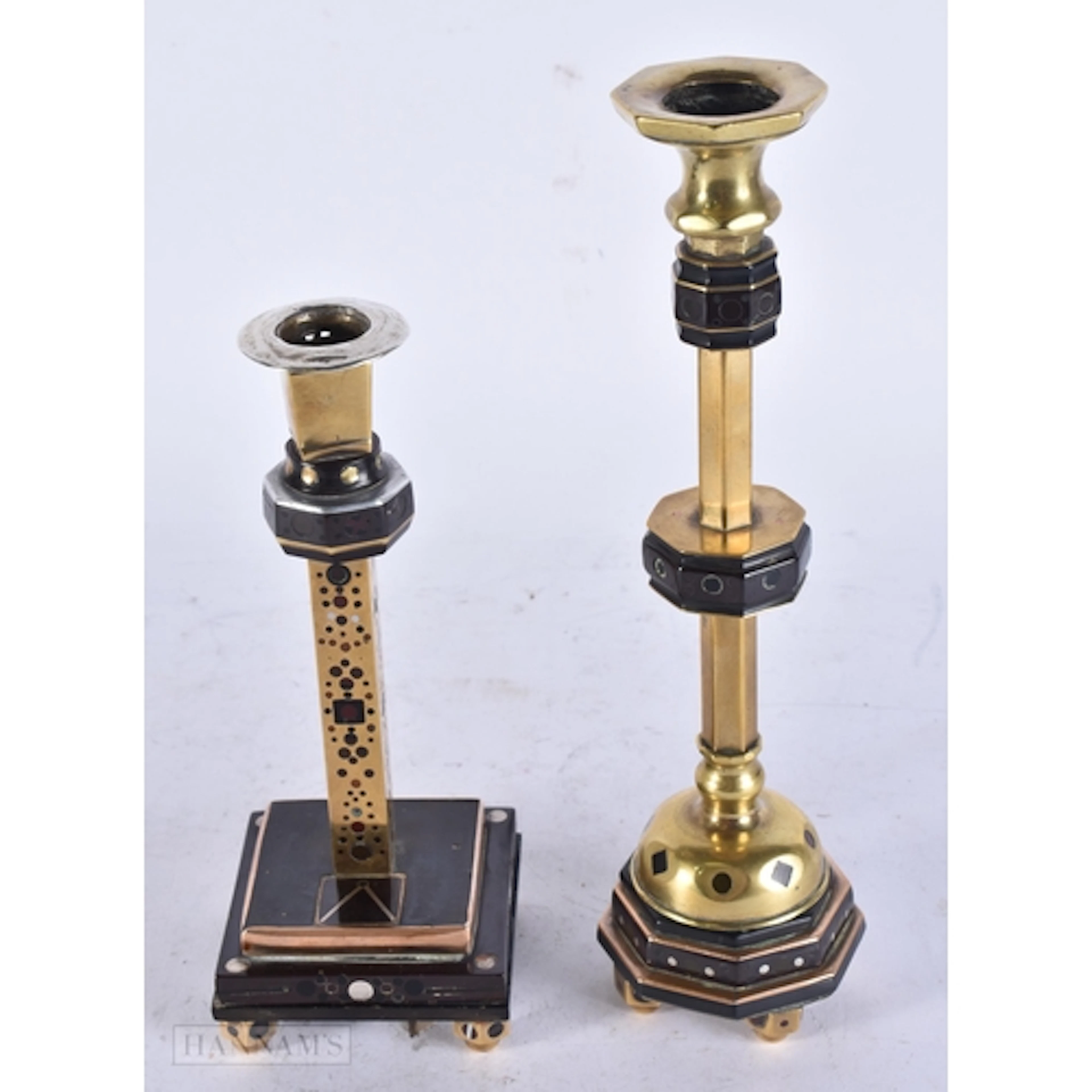 TWO RARE ANTIQUE CHERRY COLOURED CANDLESTICKS possibly early...