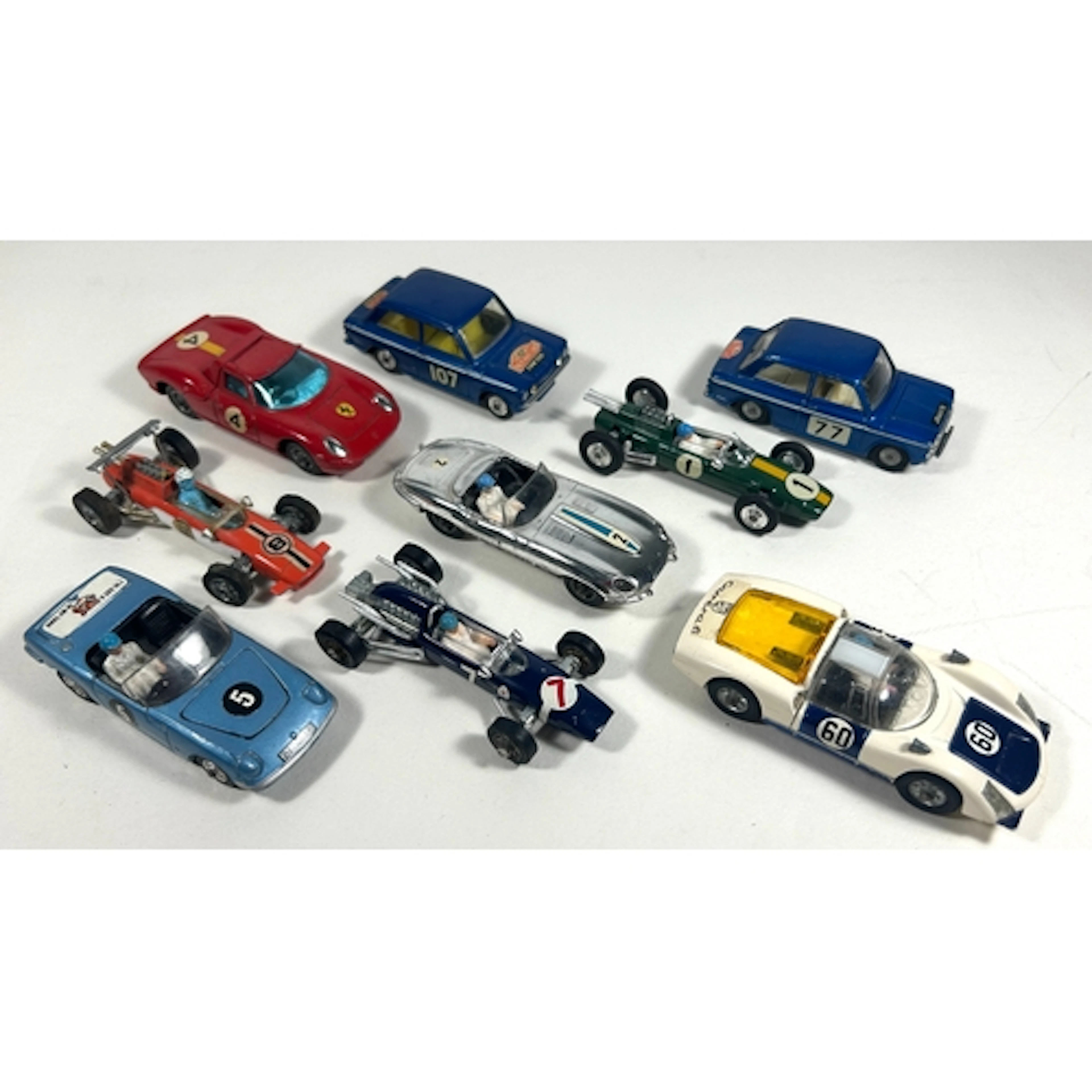 9 Corgi Toys. 9 Porsche Carrera 6 in white and dark blue, RN...