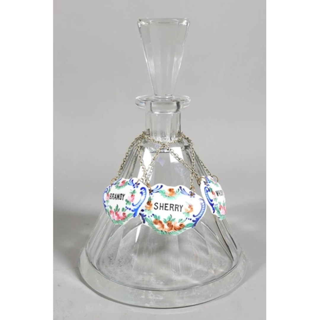 Glass decanter with glass stopper and three bone china liquo...