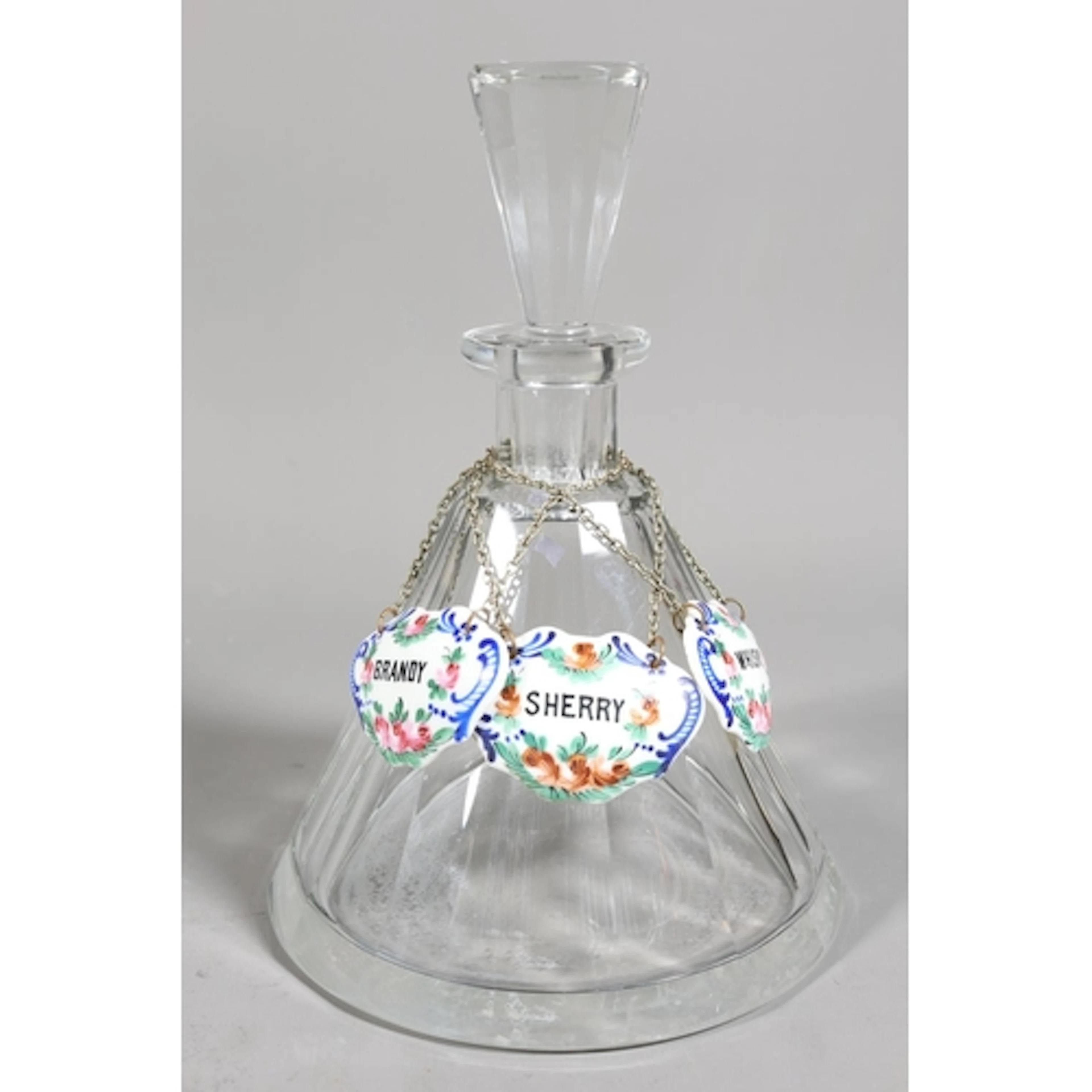 Glass decanter with glass stopper and three bone china liquo...