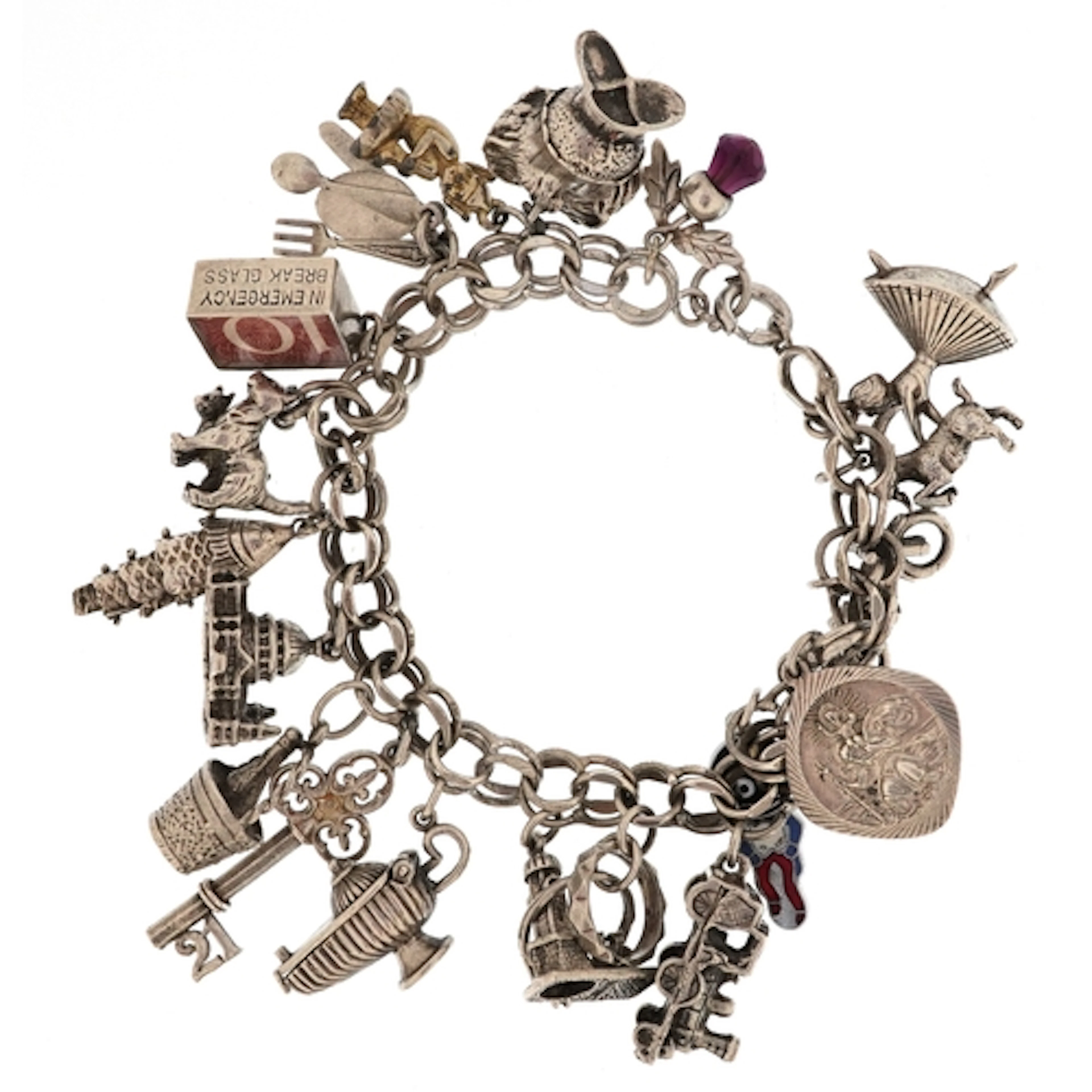 Silver charm bracelet with a large selection of mostly silve...