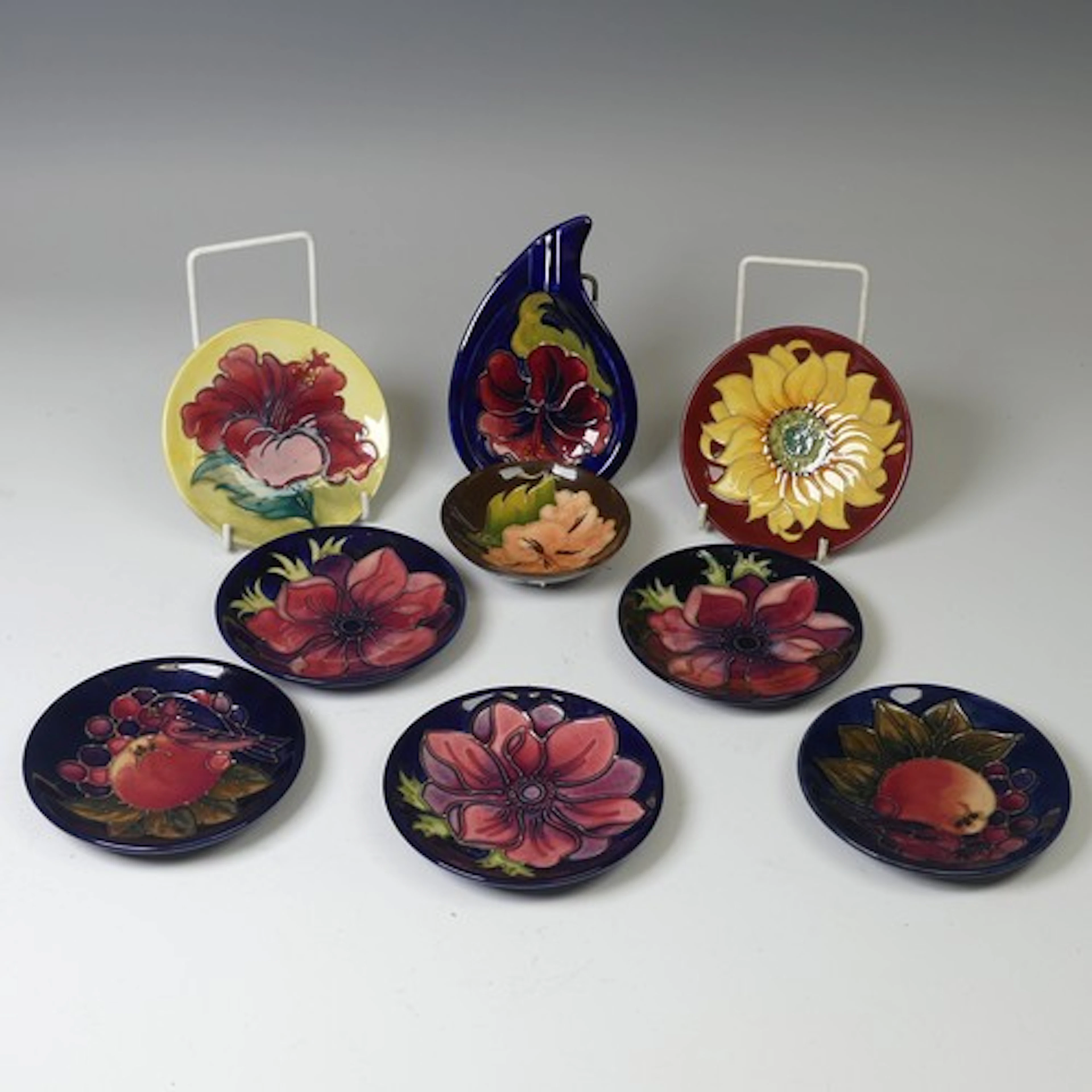 A Collection of seven Moorcroft Pottery pin Dishes, of vario...