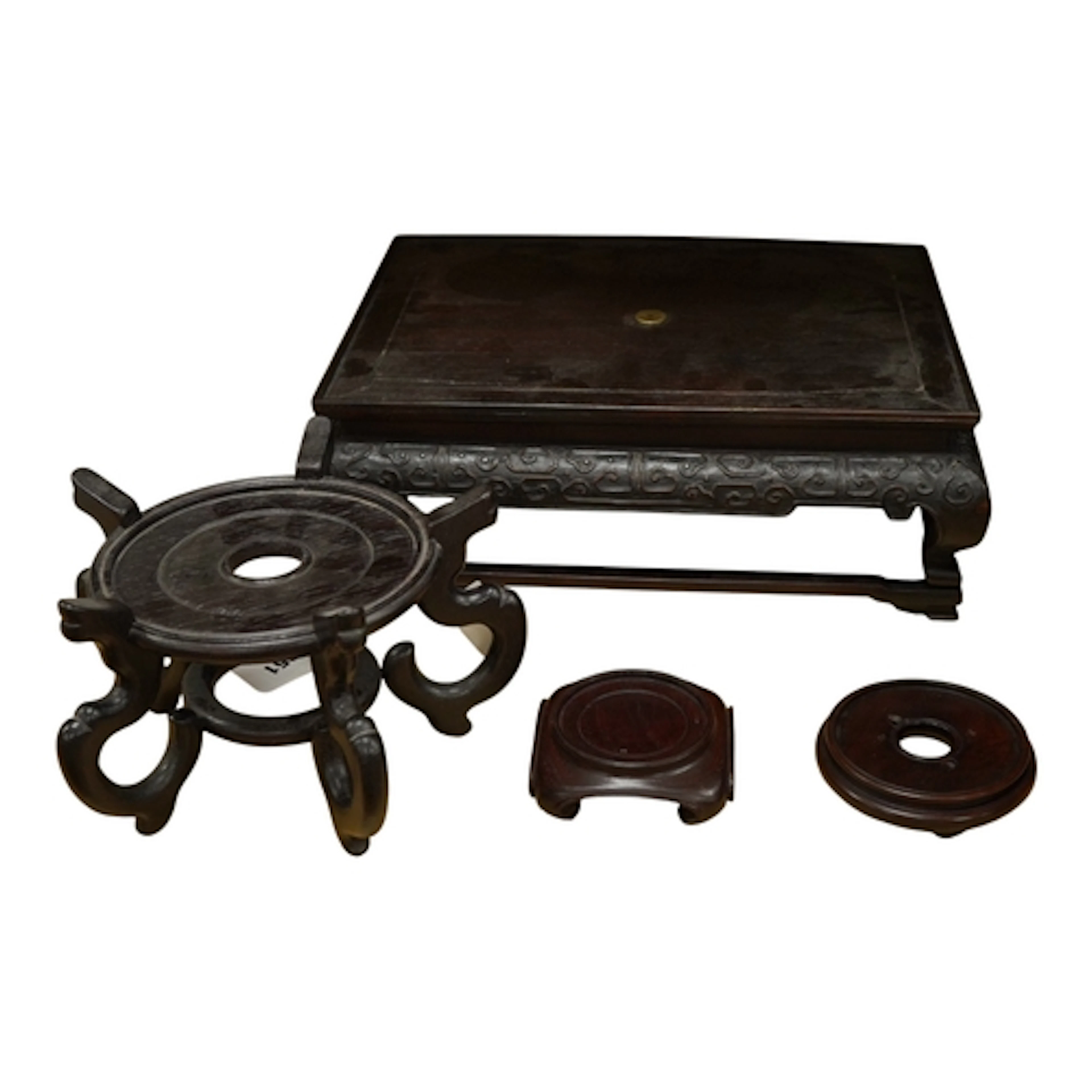 Four hardwood Chinese stands to include a large rectangular ...