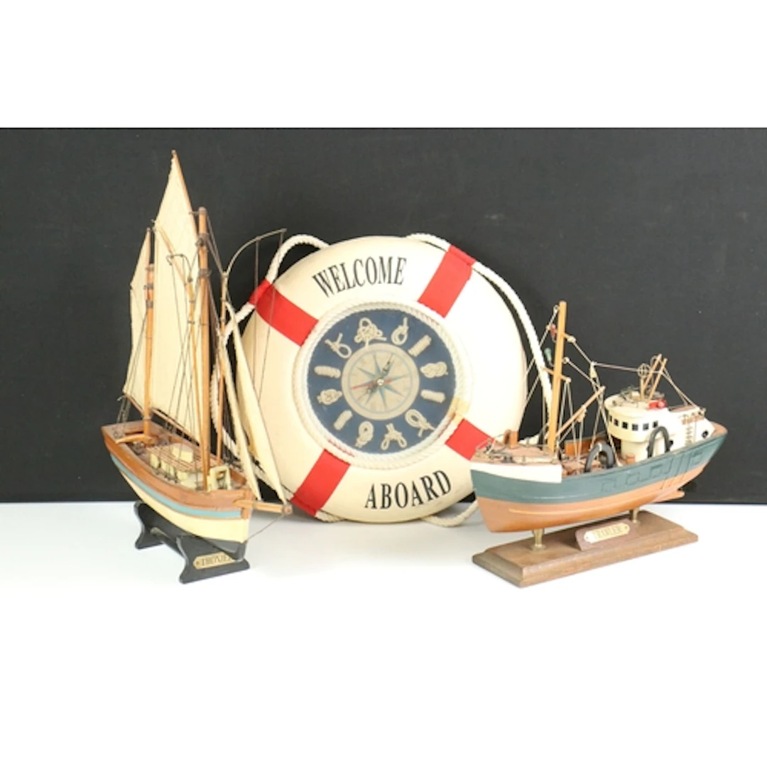 Two models of sailing boats, both having painted bodies, rai...