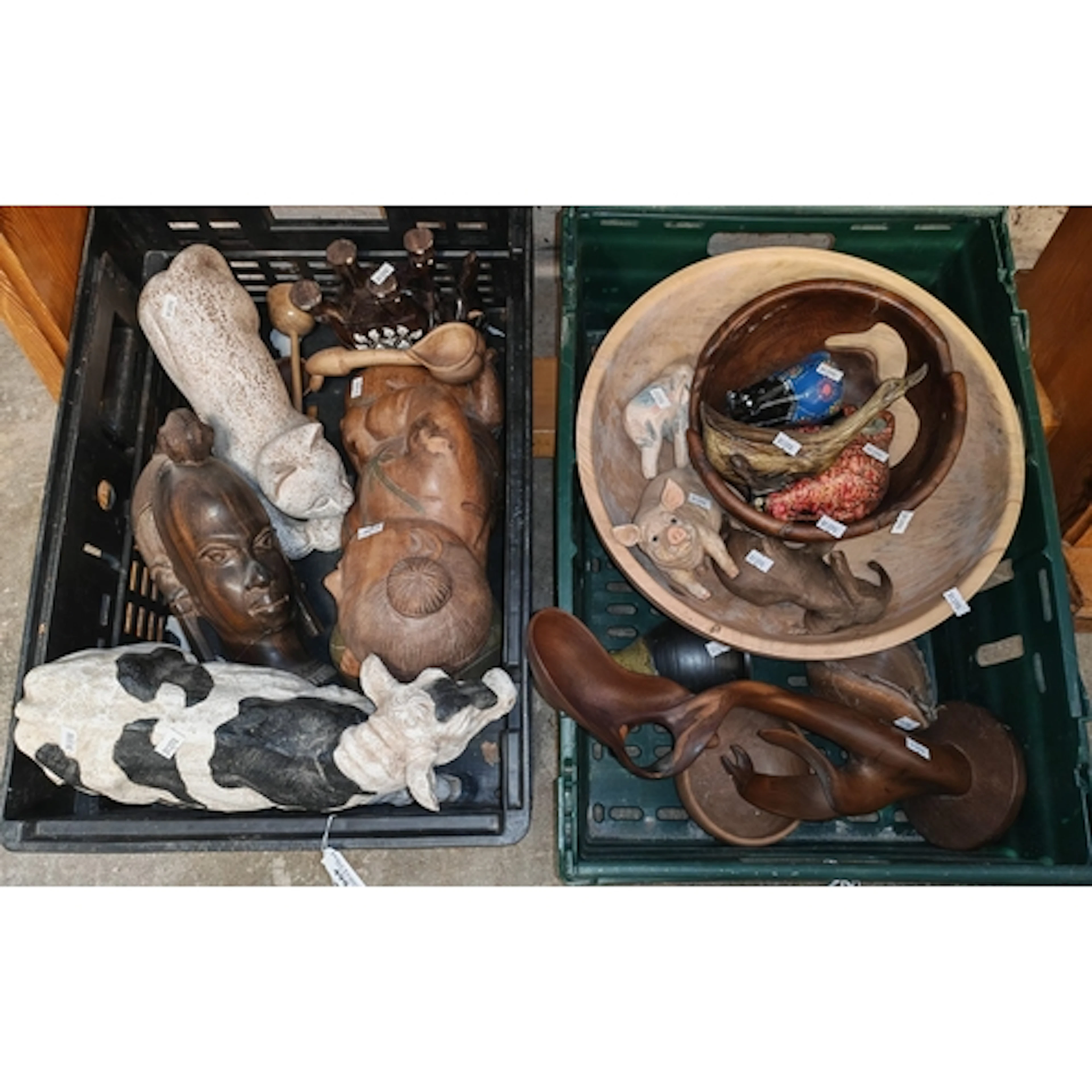 Two crates of assorted mainly carved wooden ornamental items...