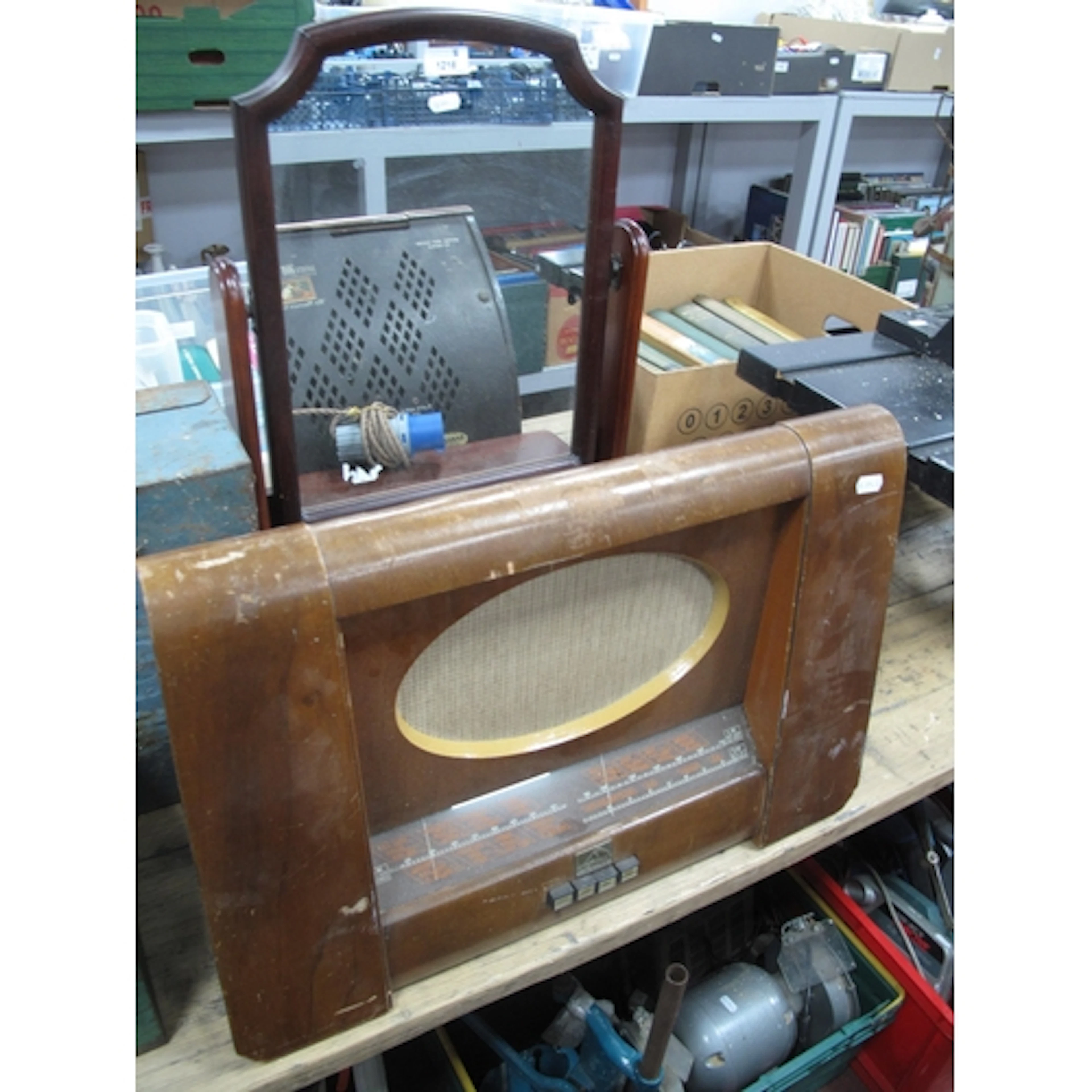 A 20th century HMV mahogany cased radio, featuring oval gril...