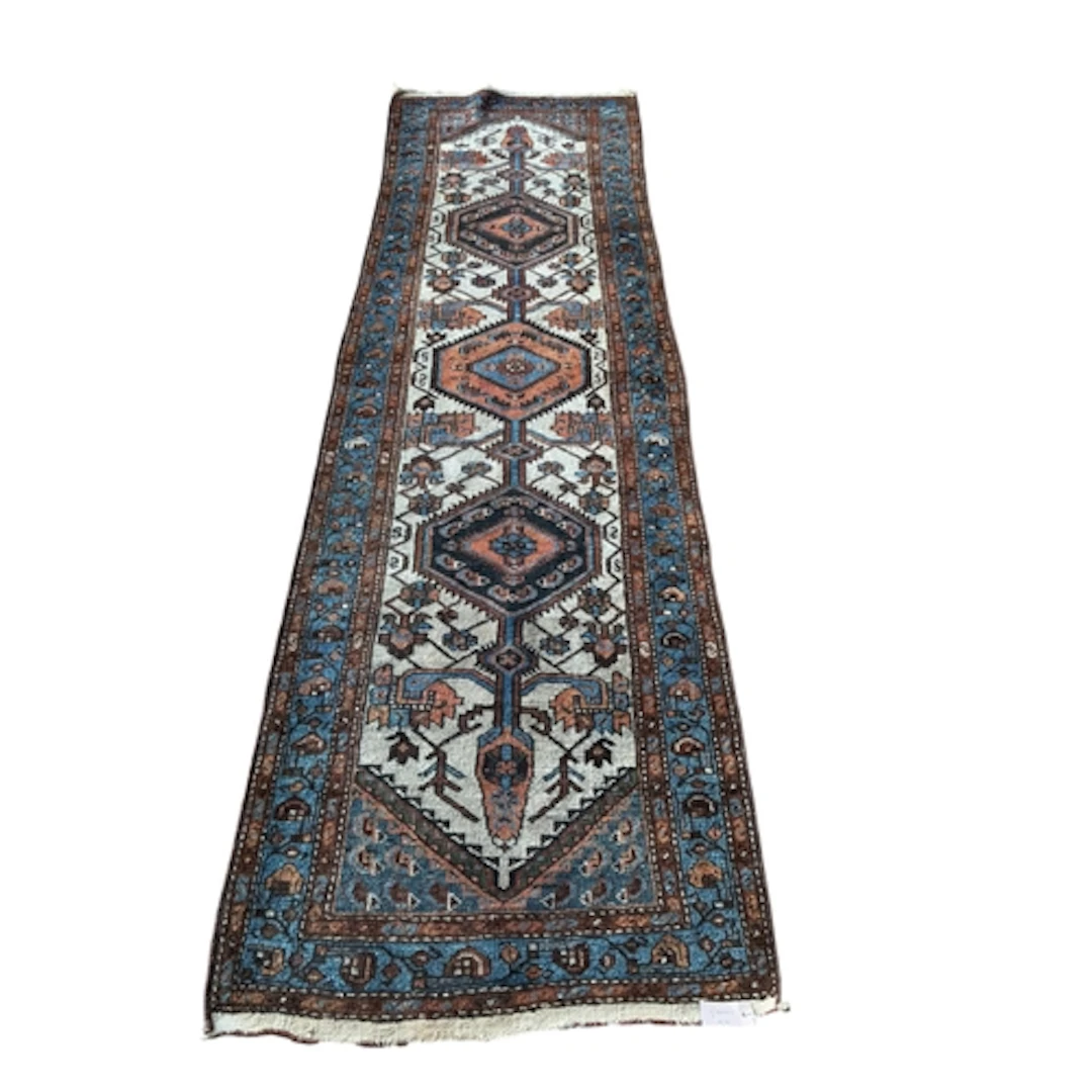 An antique Caucasian runner, 282 x 82cm