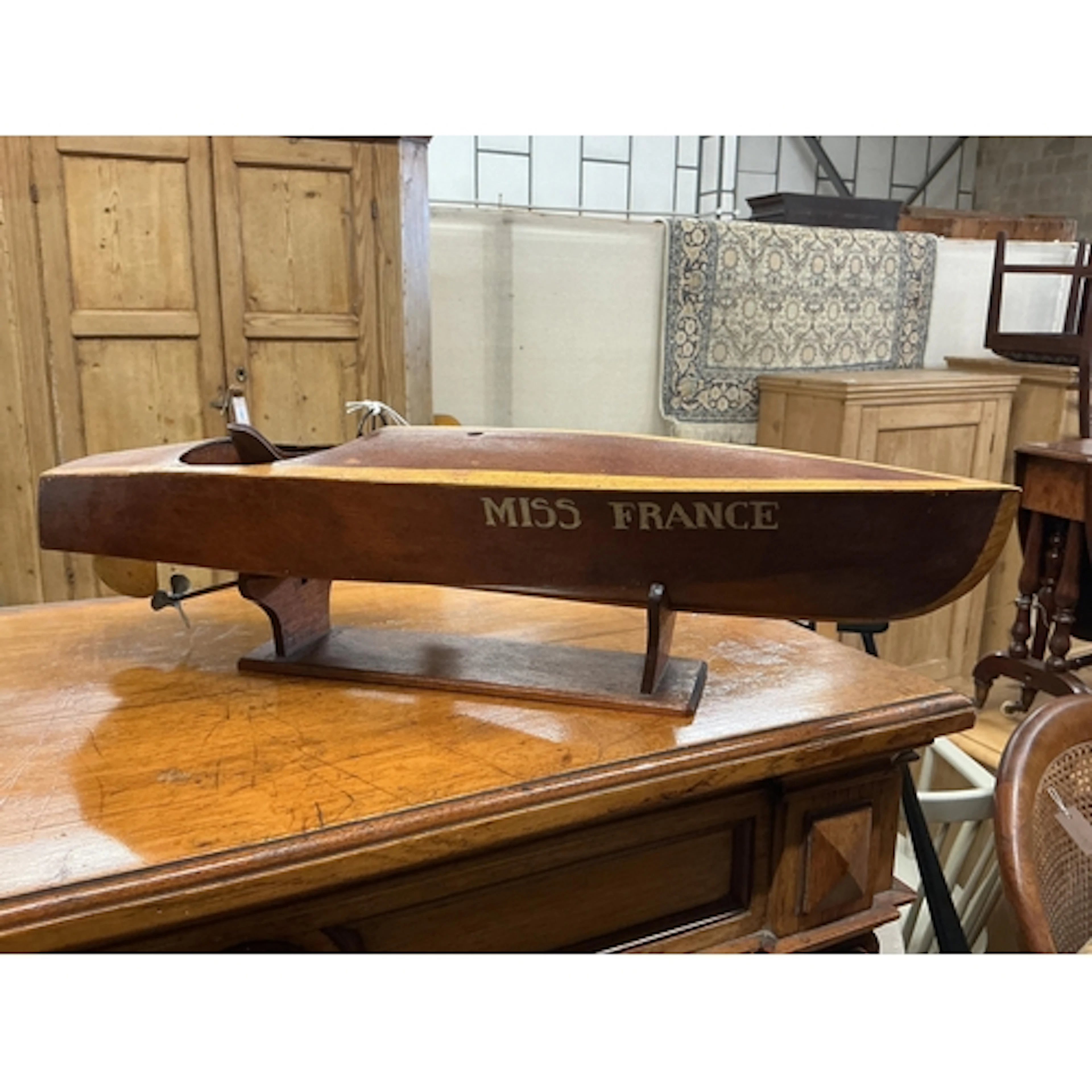 A kit built model speed boat with clockwork motor, the hull ...