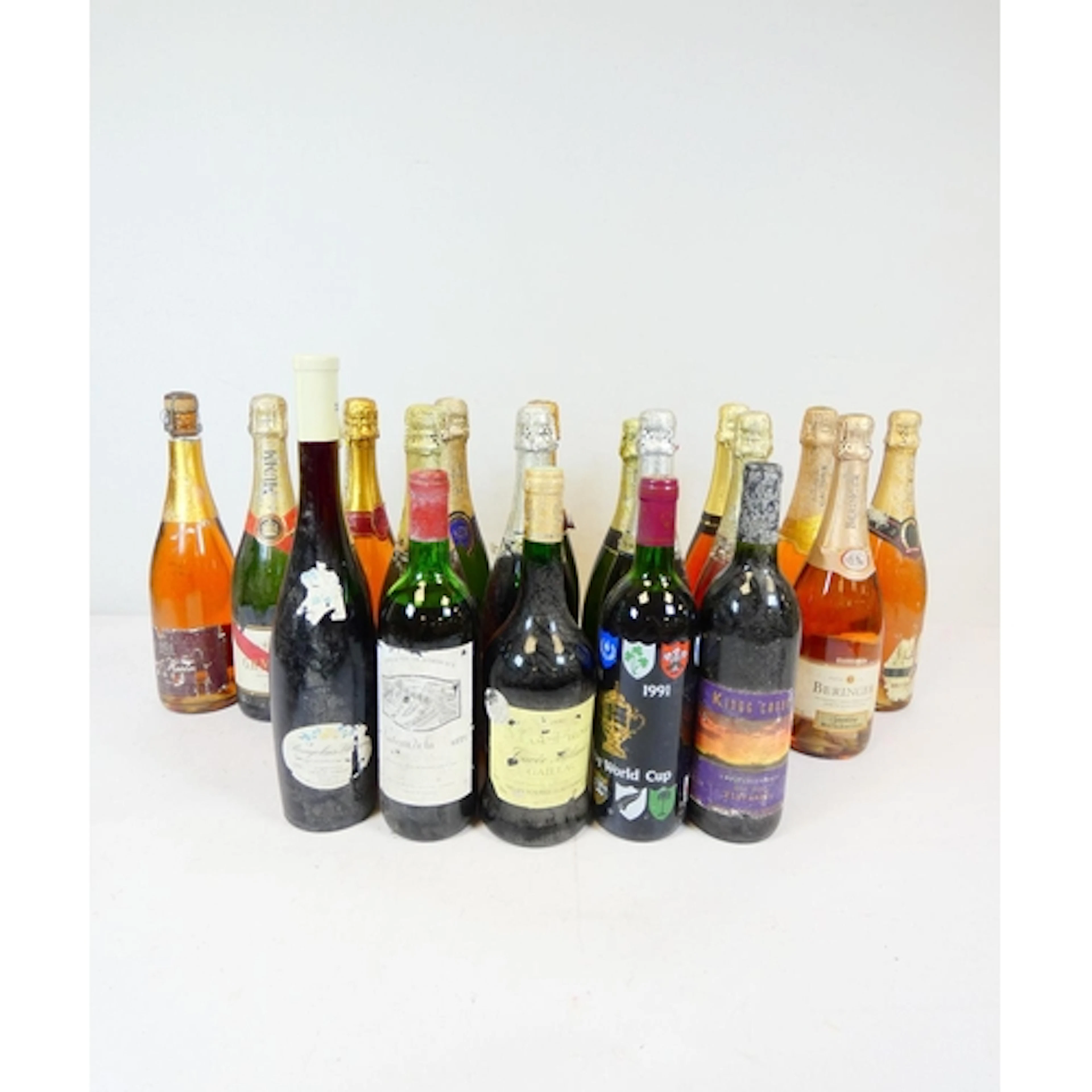 A large collection of Champagne, sparkling wine, and red win...