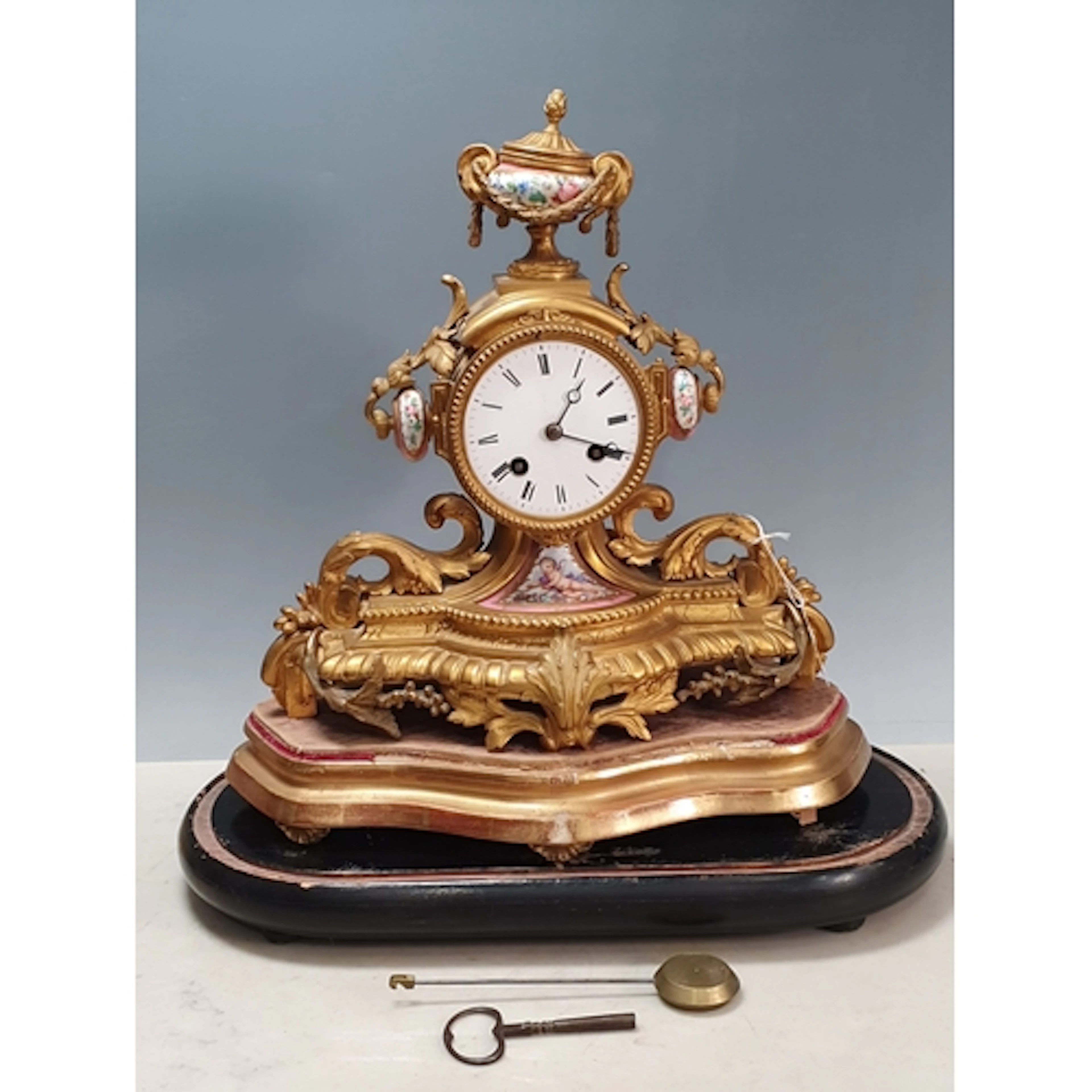 A 19th Century French gilt metal Mantle Clock with white ena...