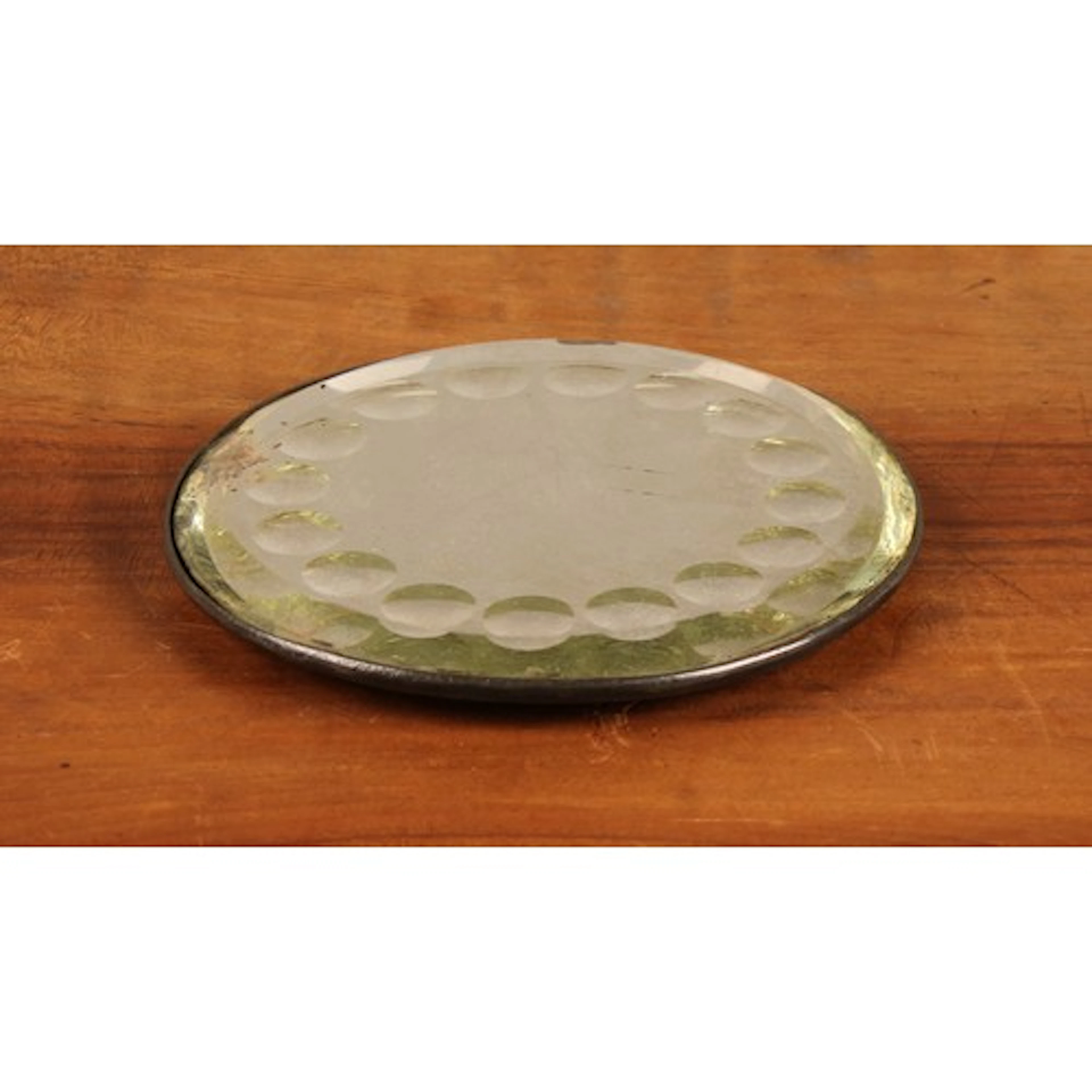An early 20th century circular sorcerer's mirror or looking ...