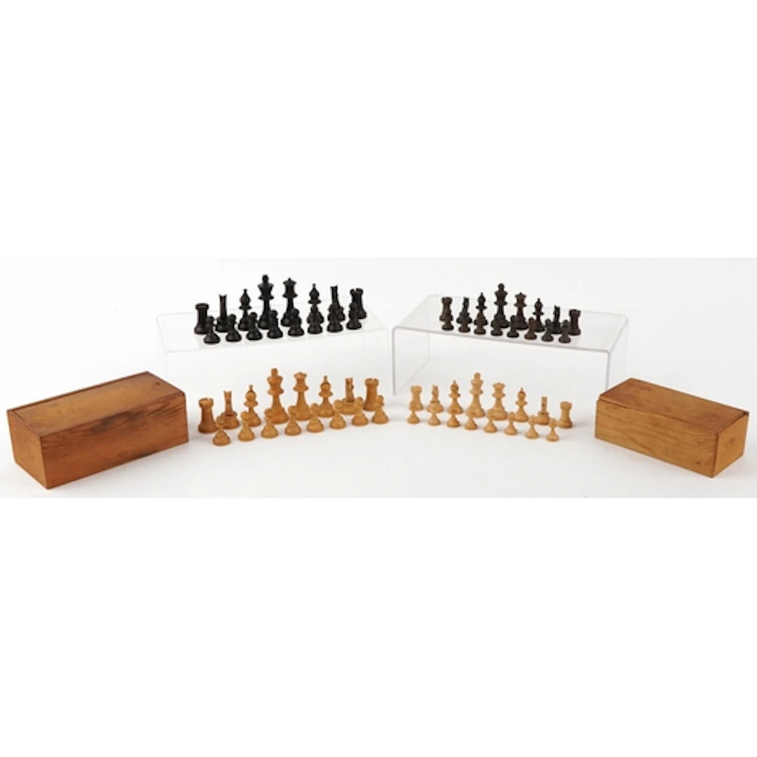 Two sets of carved wooden chess figures, the largest pieces ...