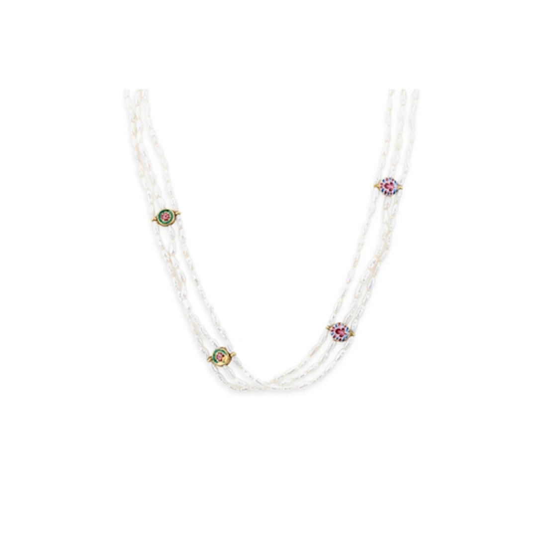 A VINTAGE THREE ROWED STRING OF BAROQUE SEED PEARLS, clasp s...