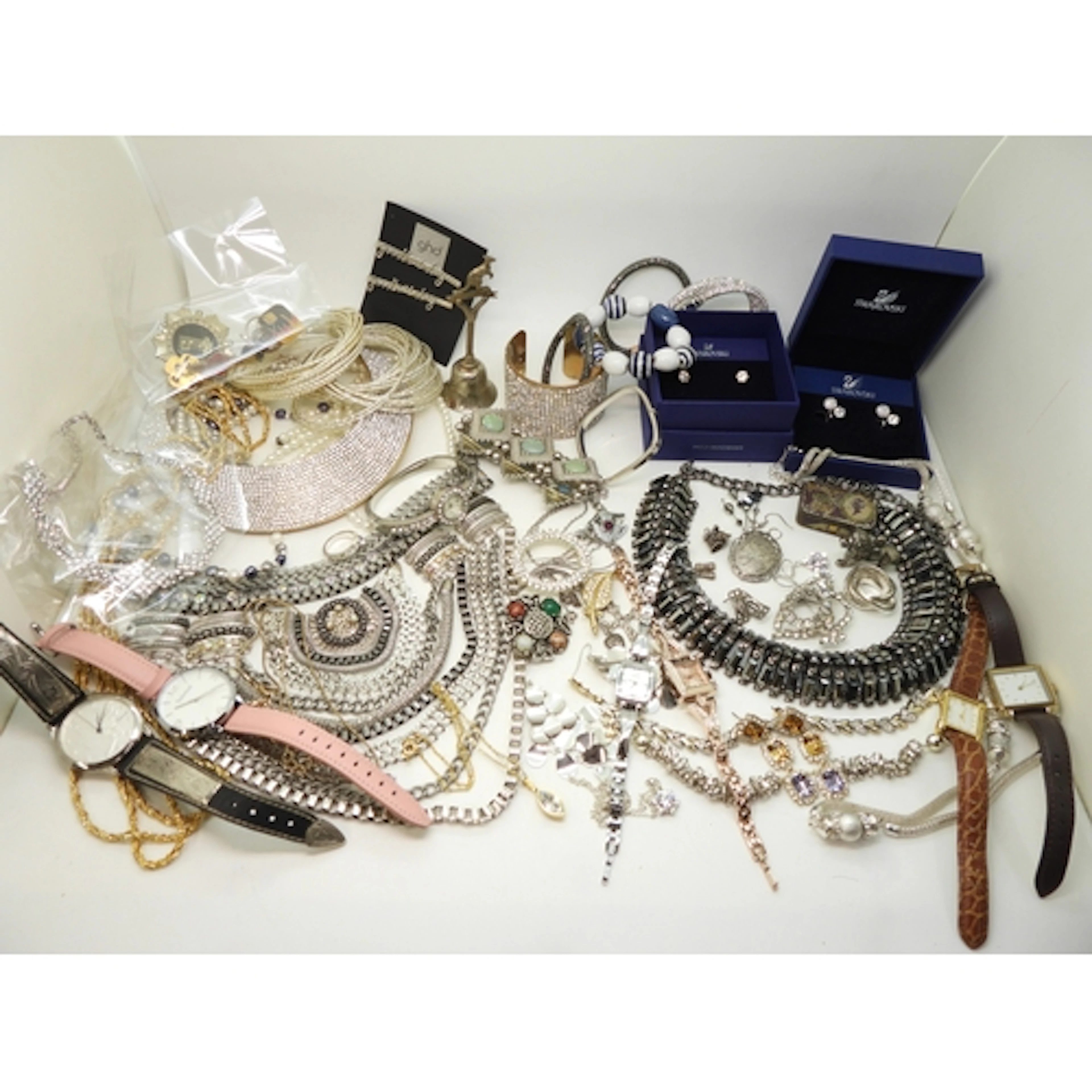 A silver bangle and brooch, statement collar necklaces and b...