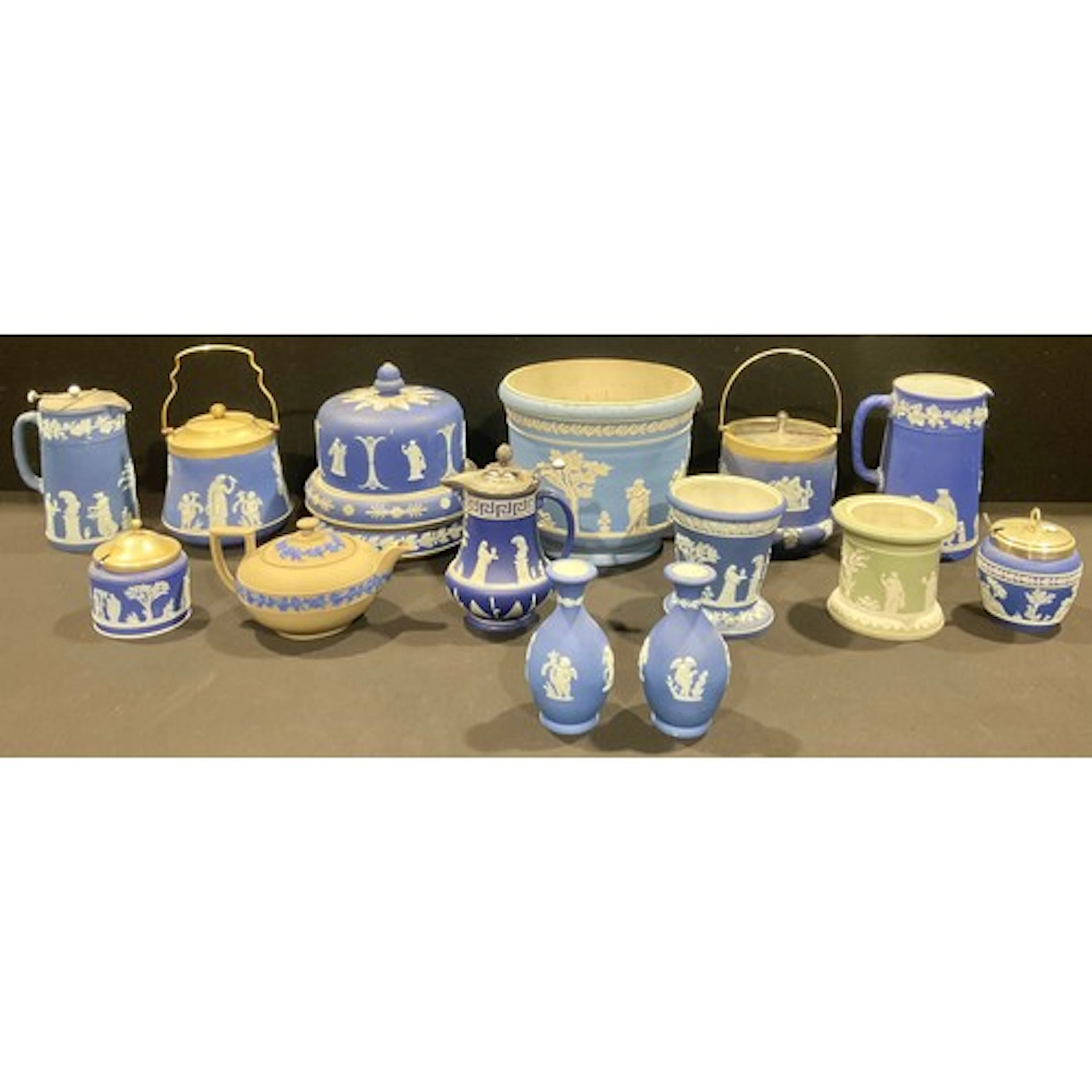 A Wedgwood blue Jasperware jug, typically sprigged with clas...