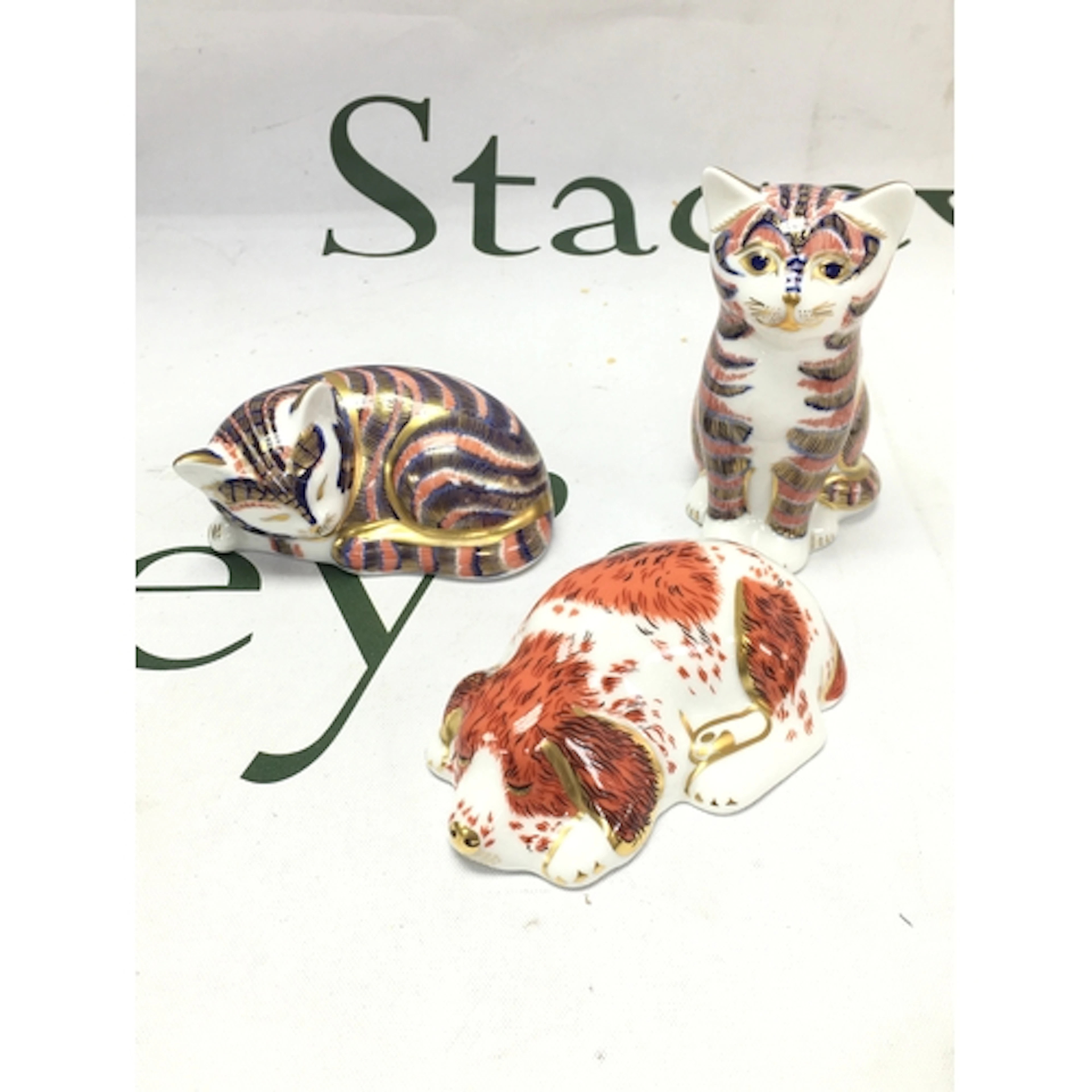 Three Royal Crown Derby gold button figures , two cats and a...