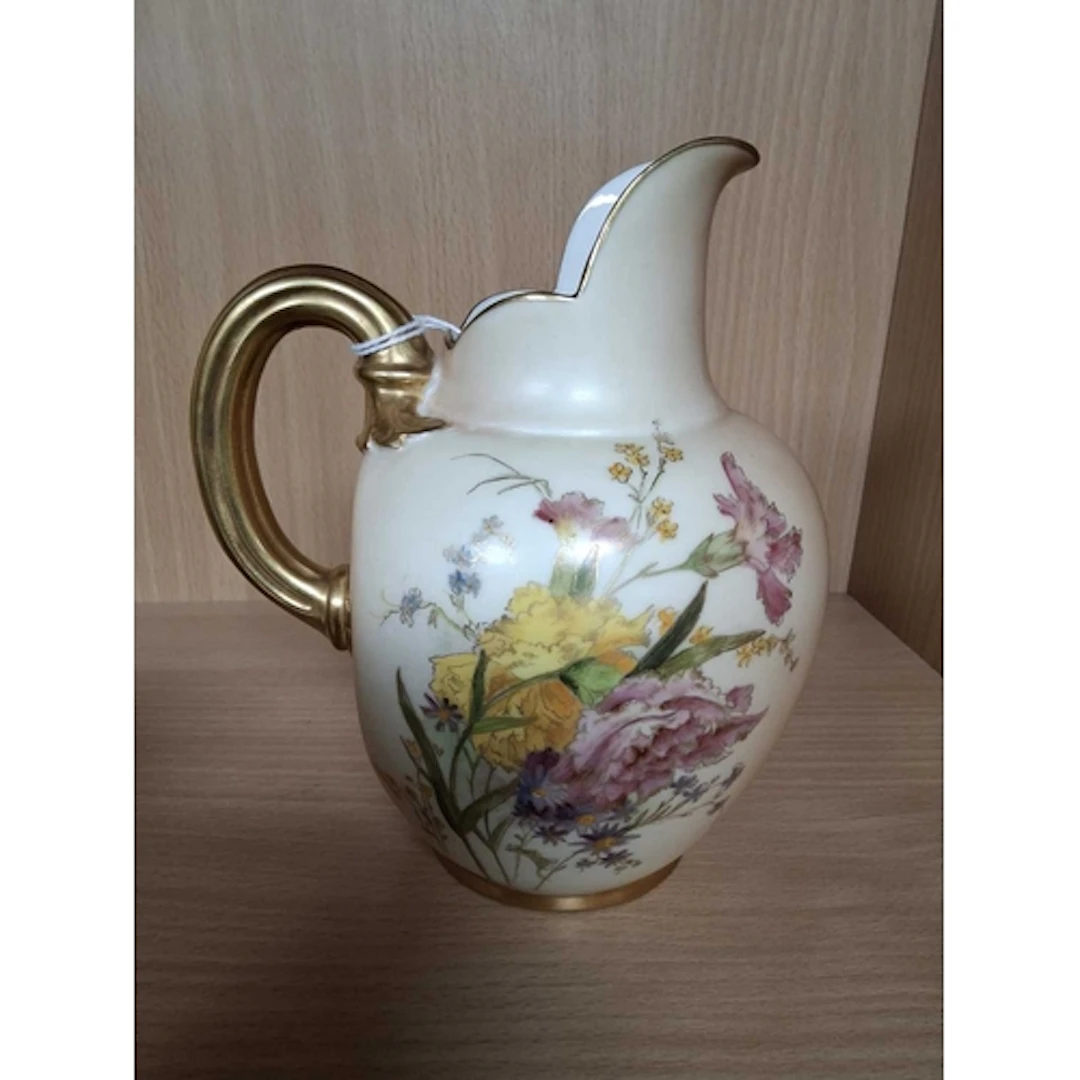 A ROYAL WORCESTER BLUSH IVORY FLAT BACK JUG, decorated with ...