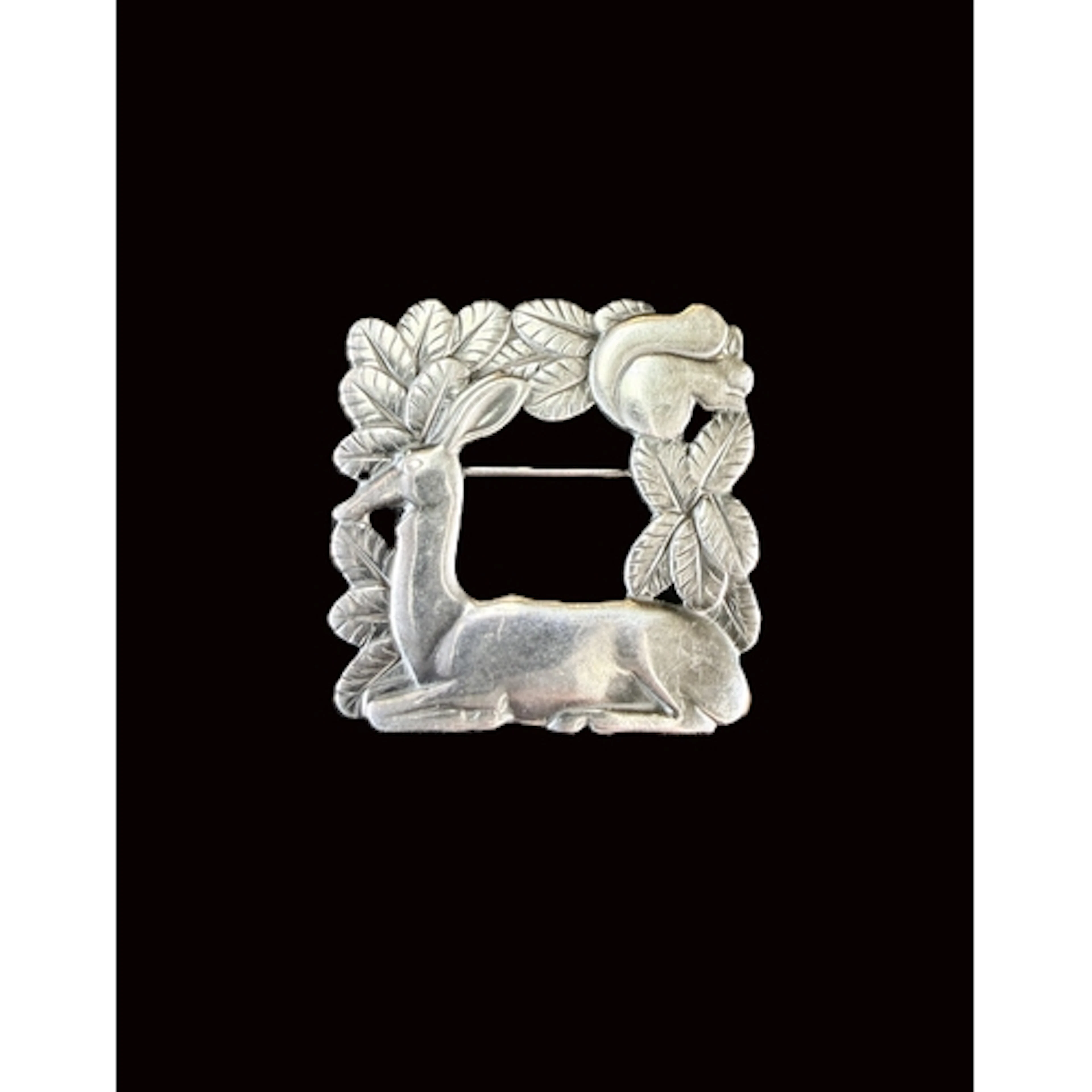 Georg Jensen: a silver openwork brooch featuring a deer at r...