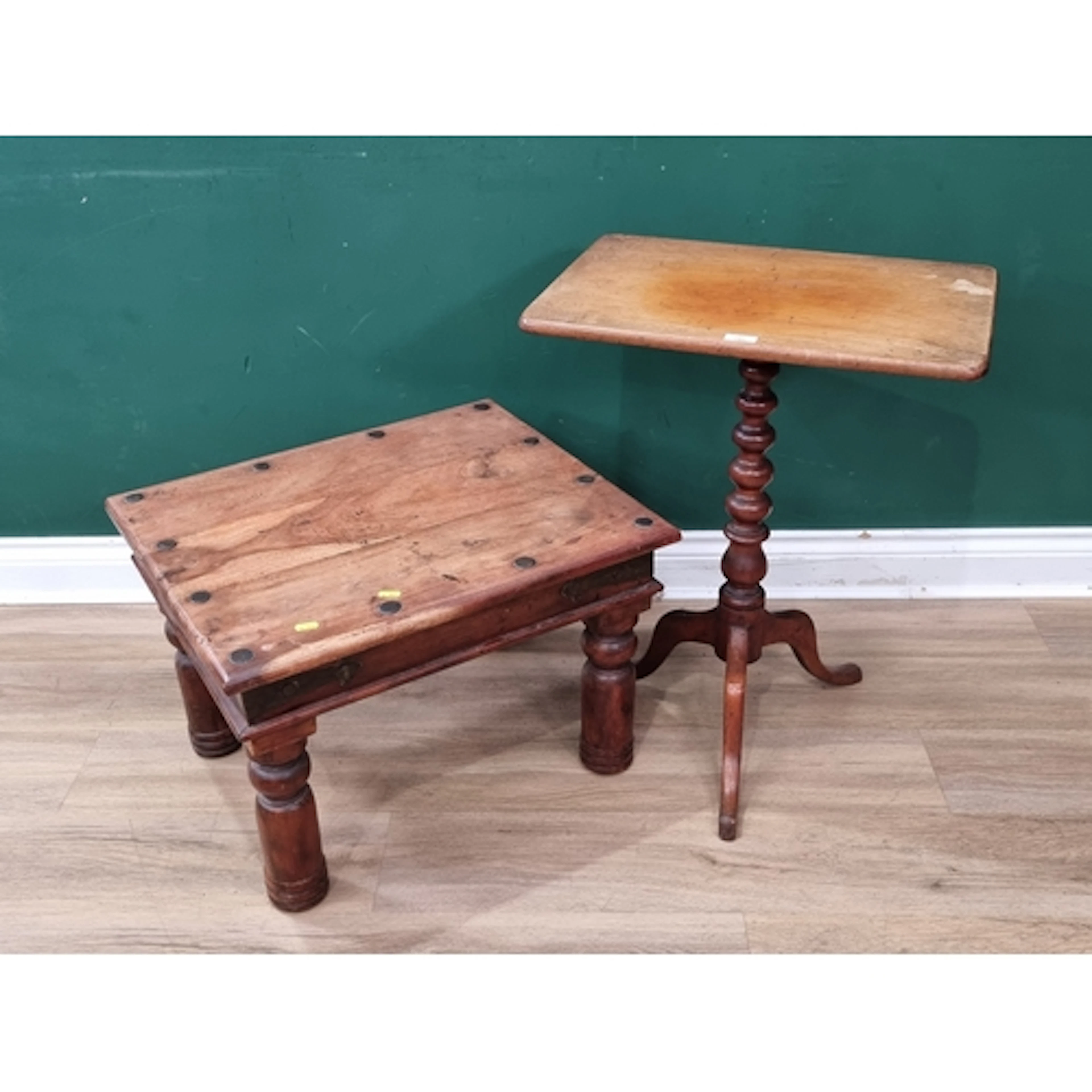 A metal studded hardwood coffee Table and a rectangular topp...