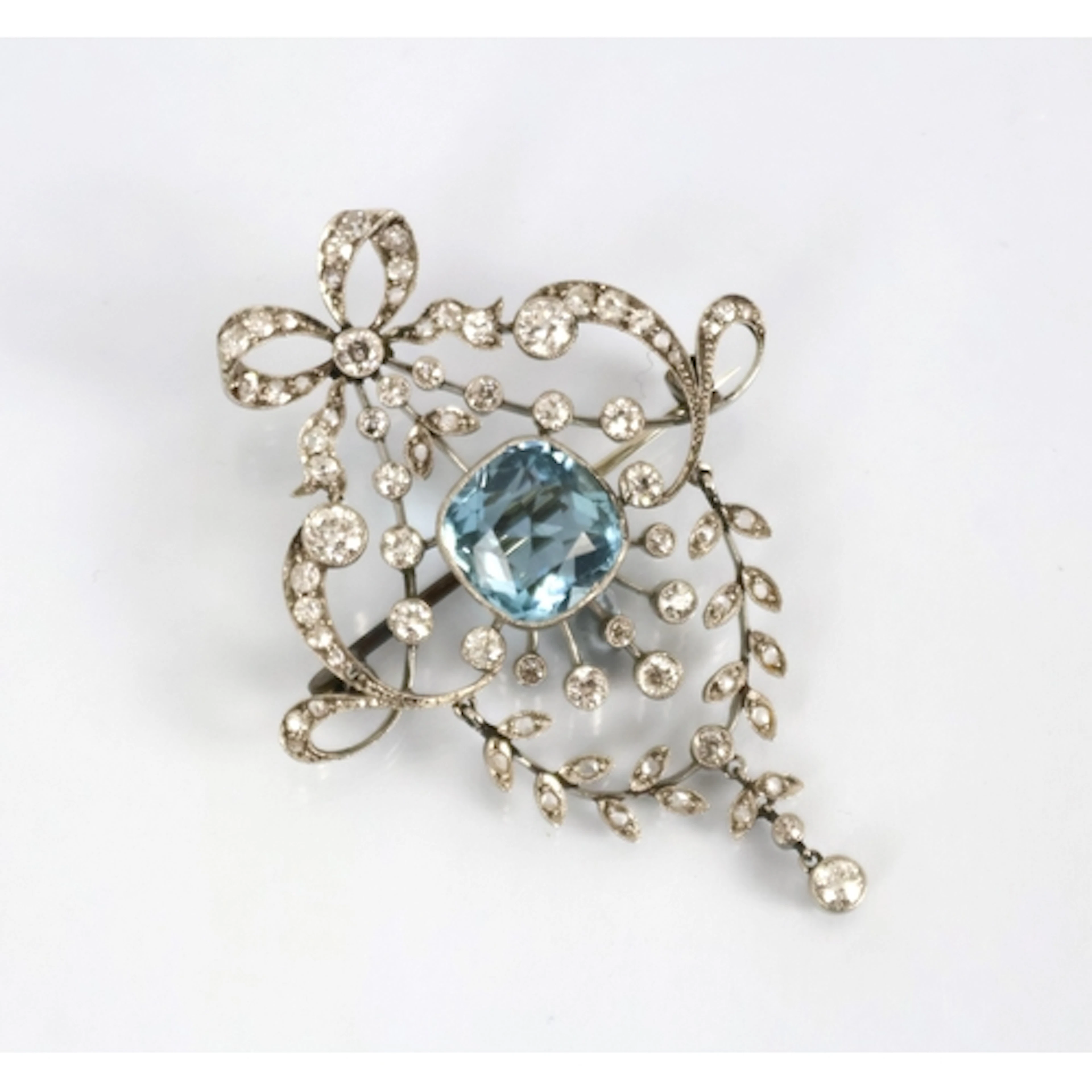 A Belle Epoque aquamarine and diamond brooch or pendant, the...