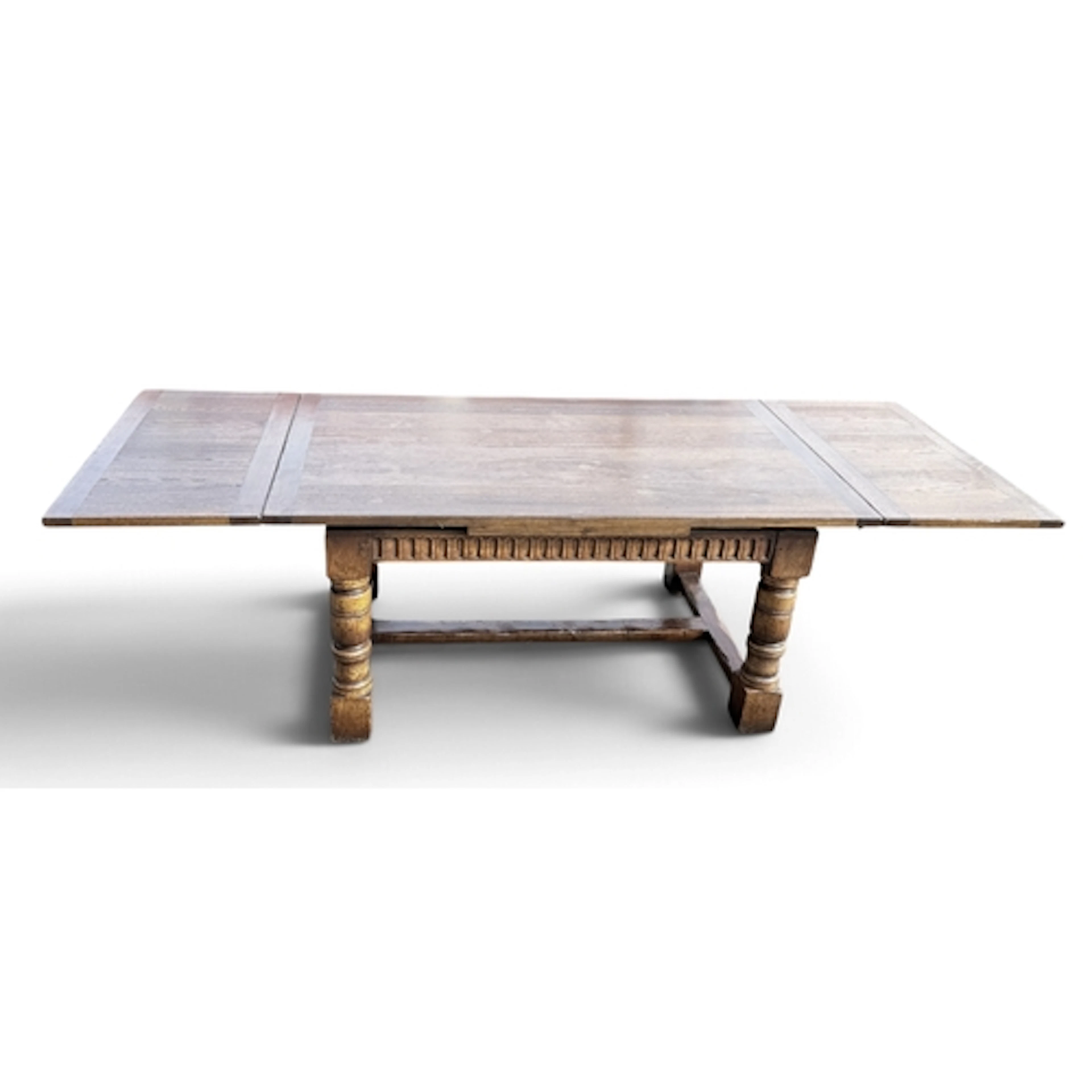 A REPRODUCTION ELIZABETHAN STYLE OAK DRAW-LEAF REFECTORY TAB...