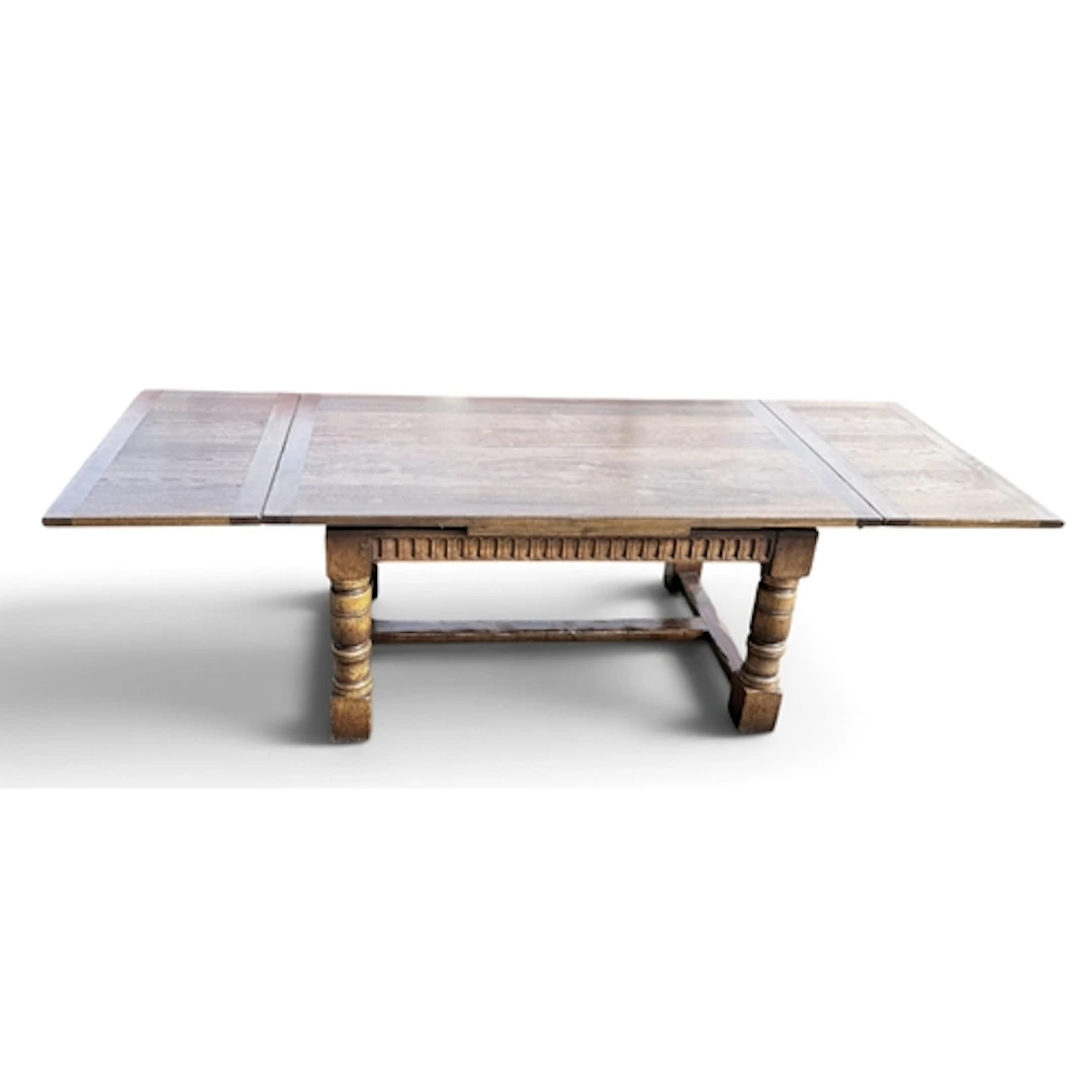 A REPRODUCTION ELIZABETHAN STYLE OAK DRAW-LEAF REFECTORY TAB...