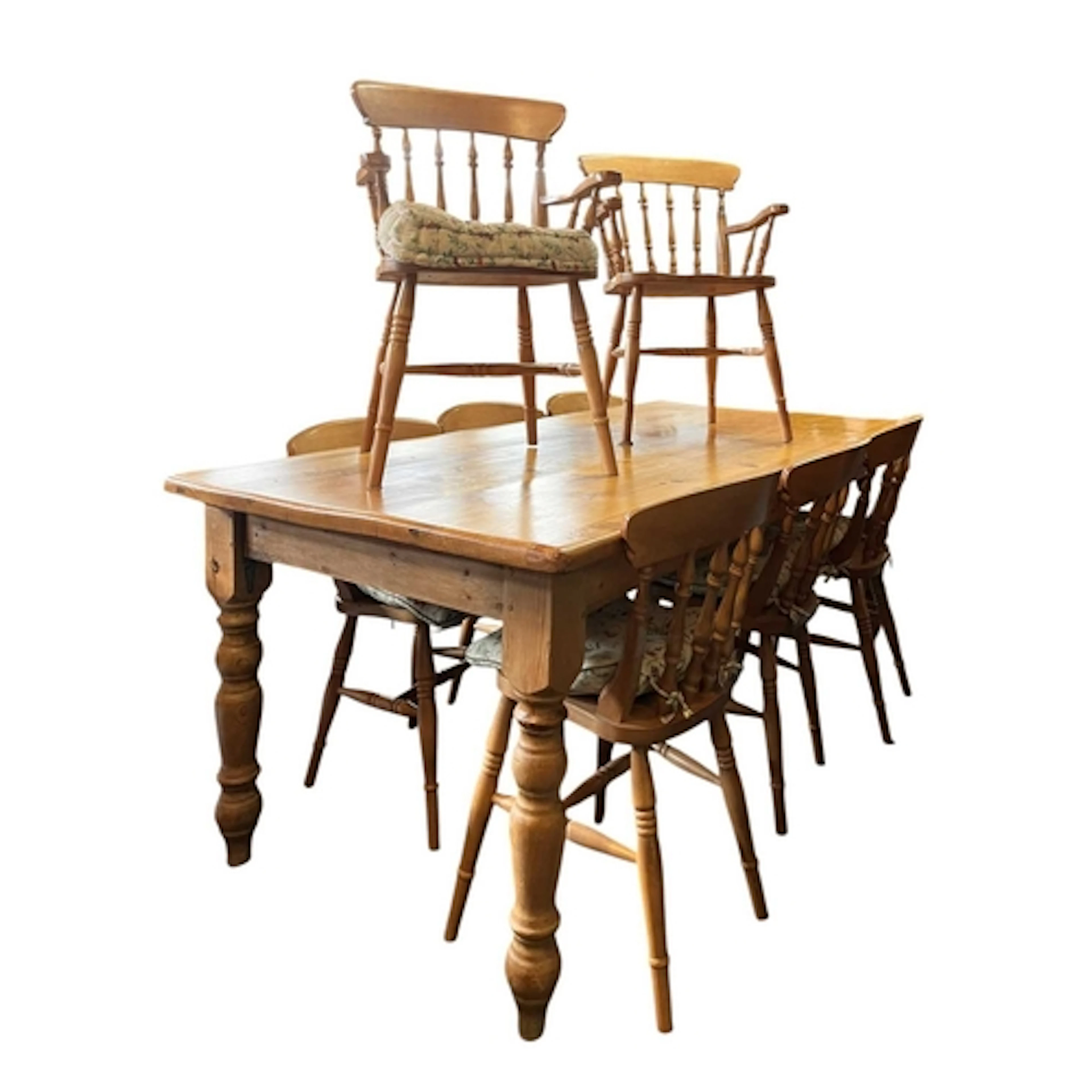 A large 20th century country pine dining or kitchen table an...