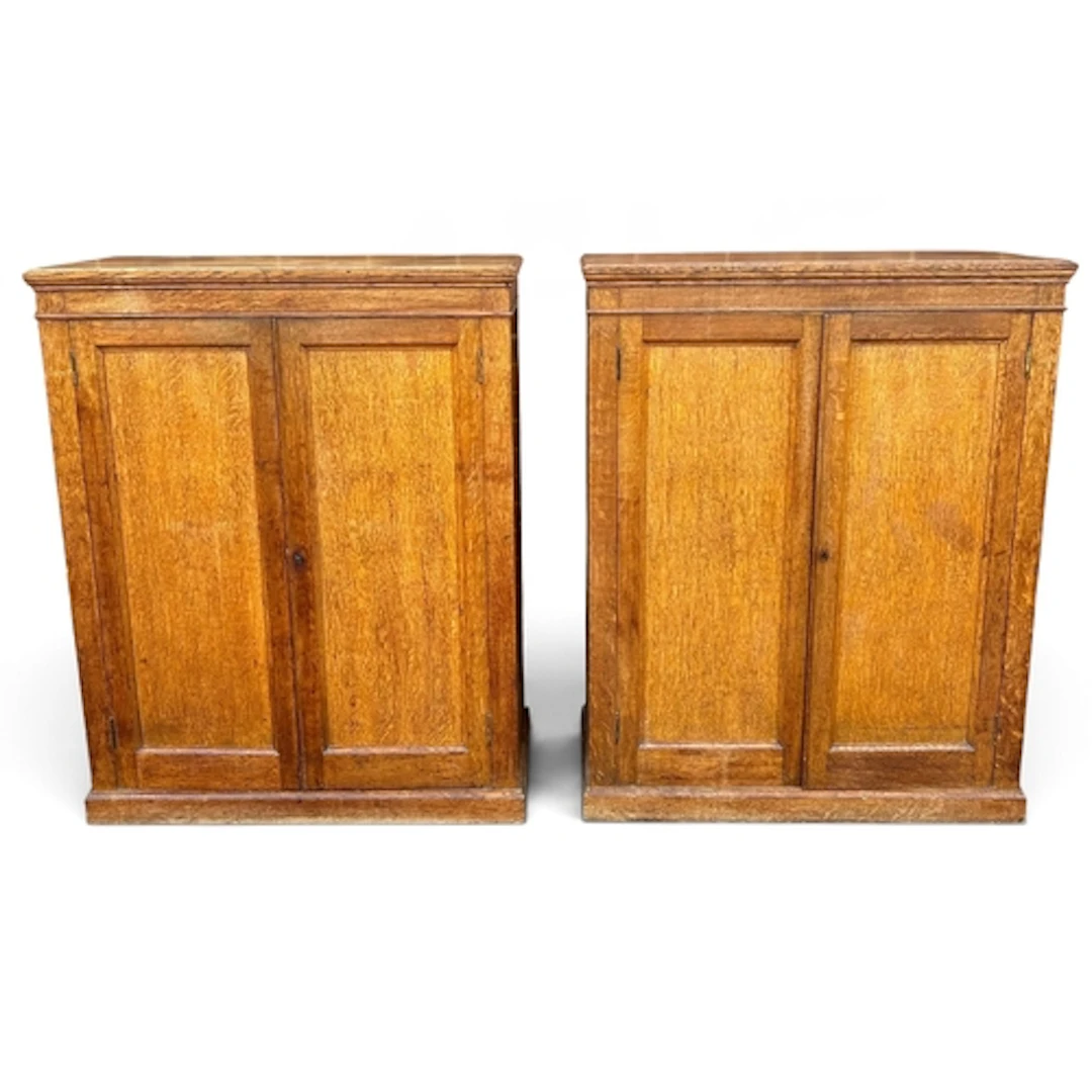 A PAIR OF EDWARDIAN LIGHT OAK DWARF SIDE CABINETS Each fitte...