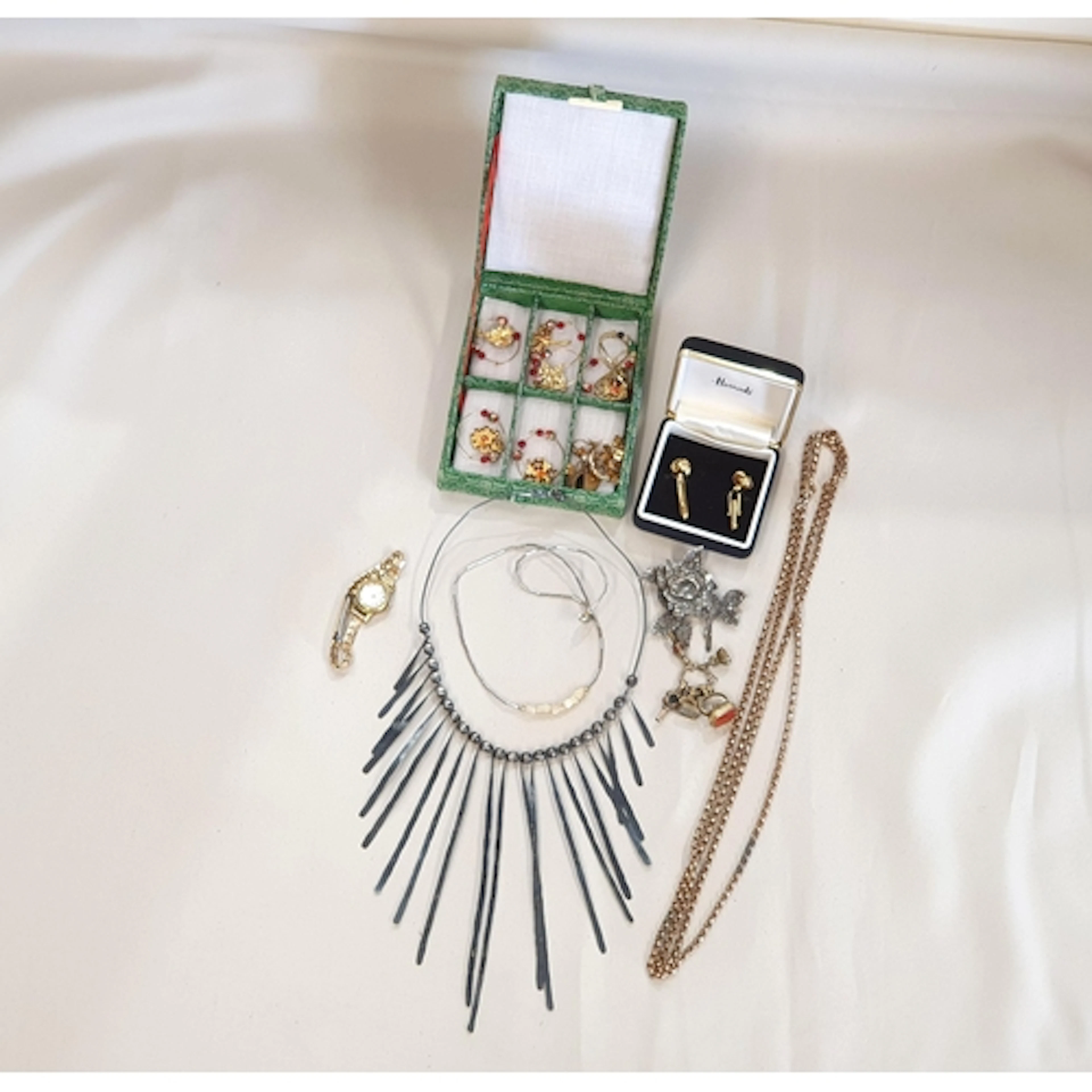 A lady's Summit Wristwatch, a gold plated Guard Chain with s...