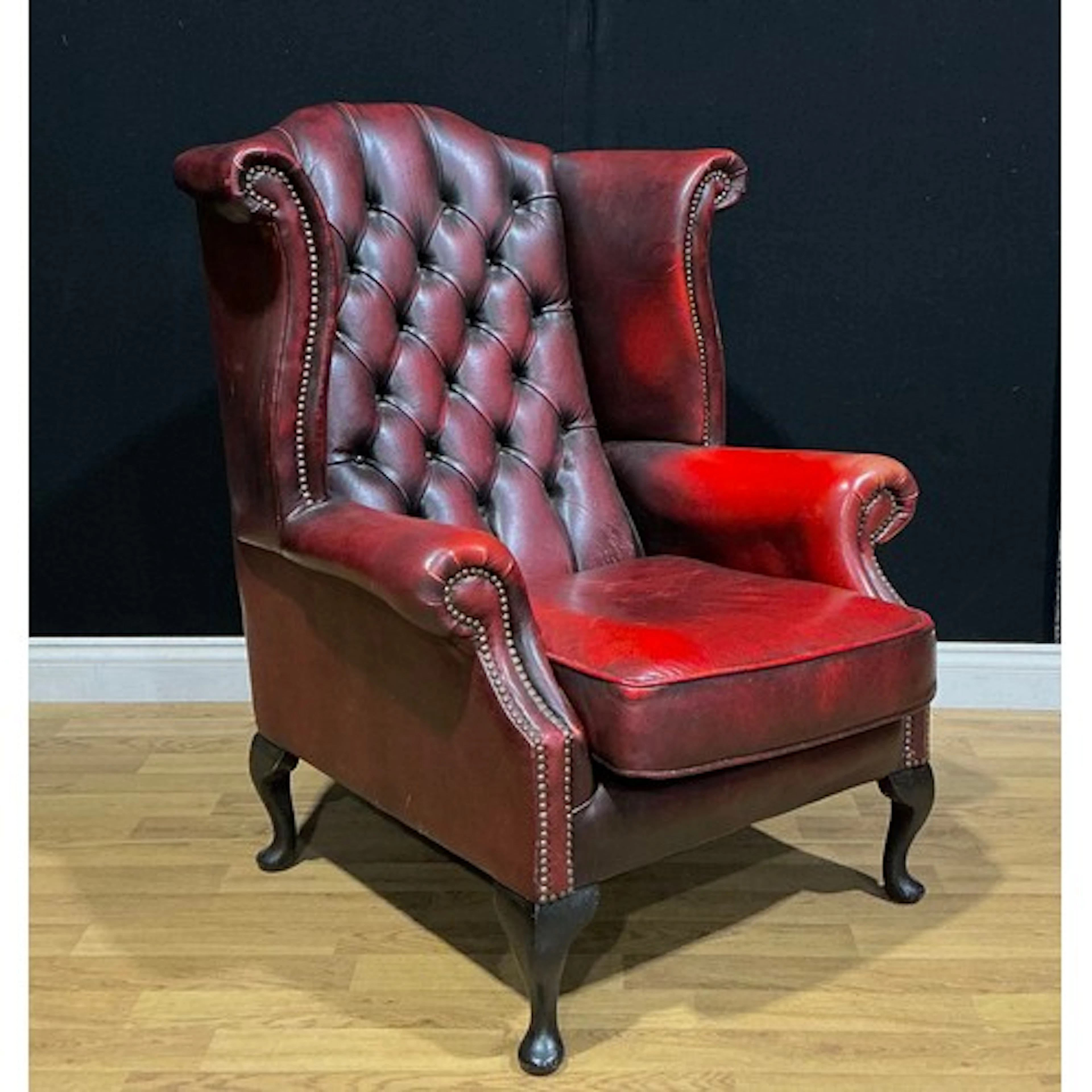 A contemporary George III style Chesterfield wing chair, 107...
