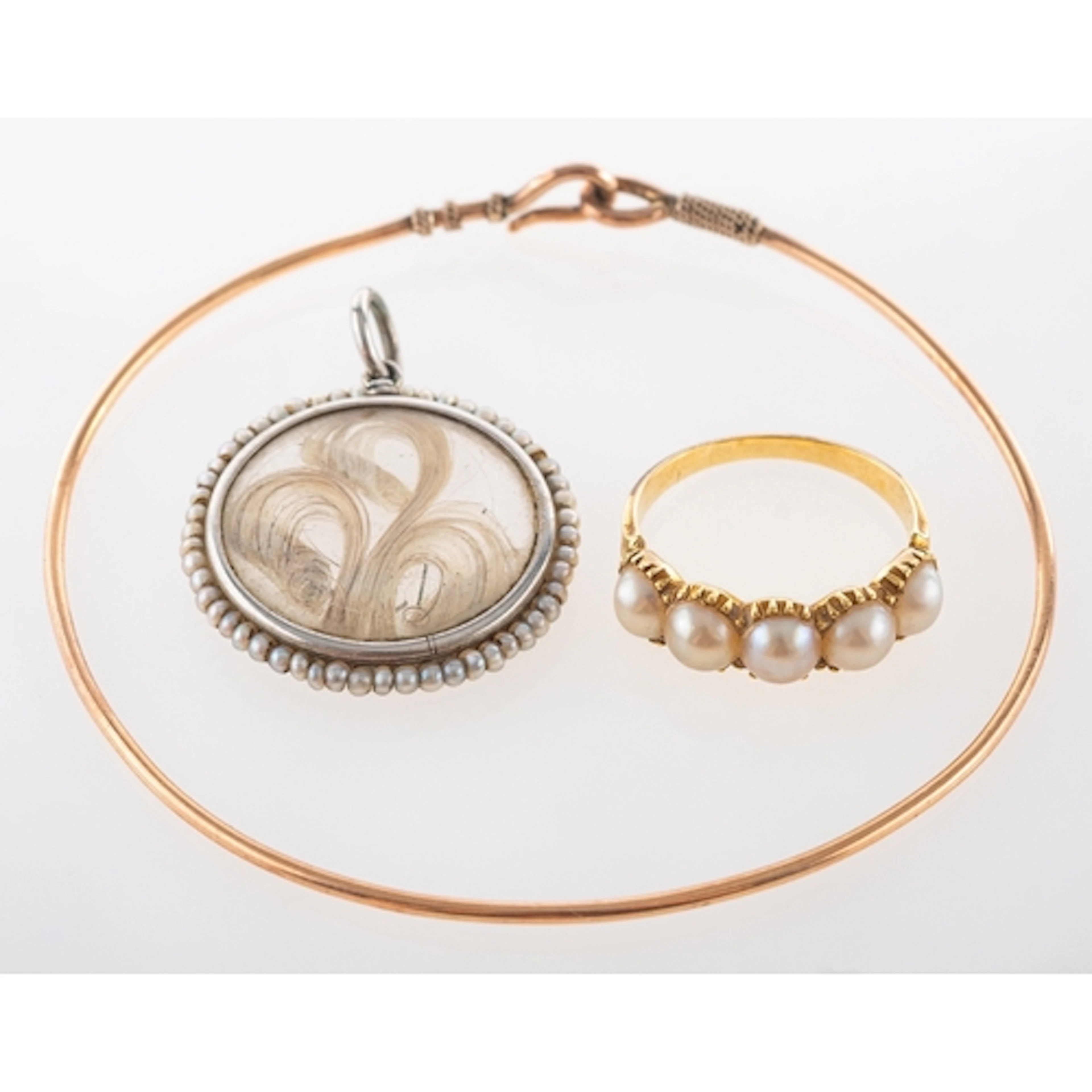 Yellow metal ring set with split seed pearls in cut down col...