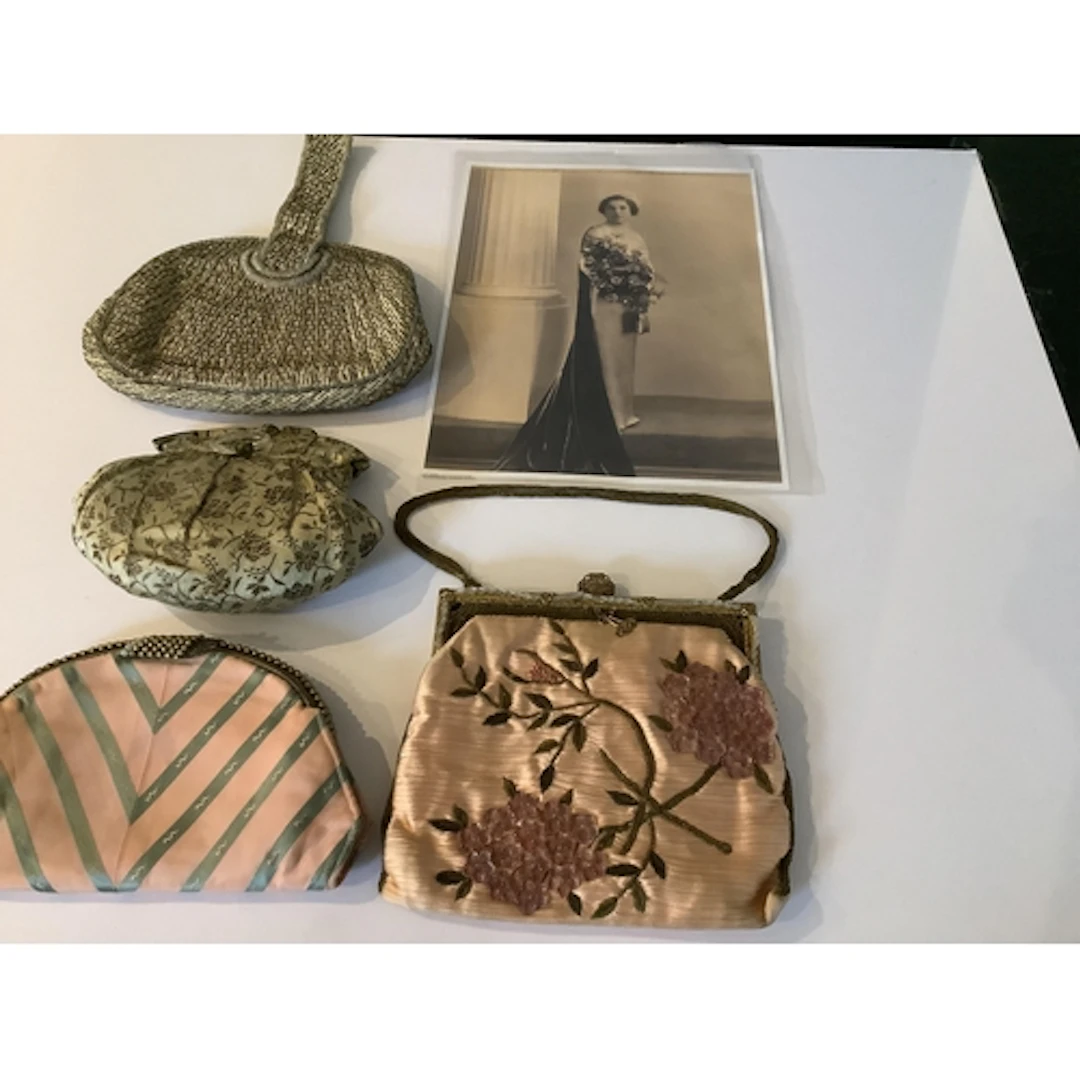 Four various 20th century evening bags, six swans down and c...