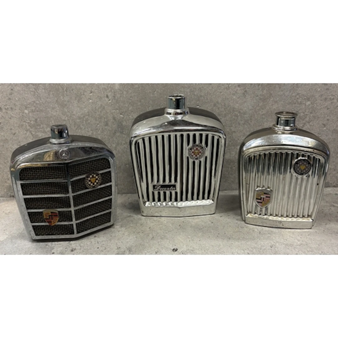 A 1960s decanter in the form of a Jaguar radiator grille tog...