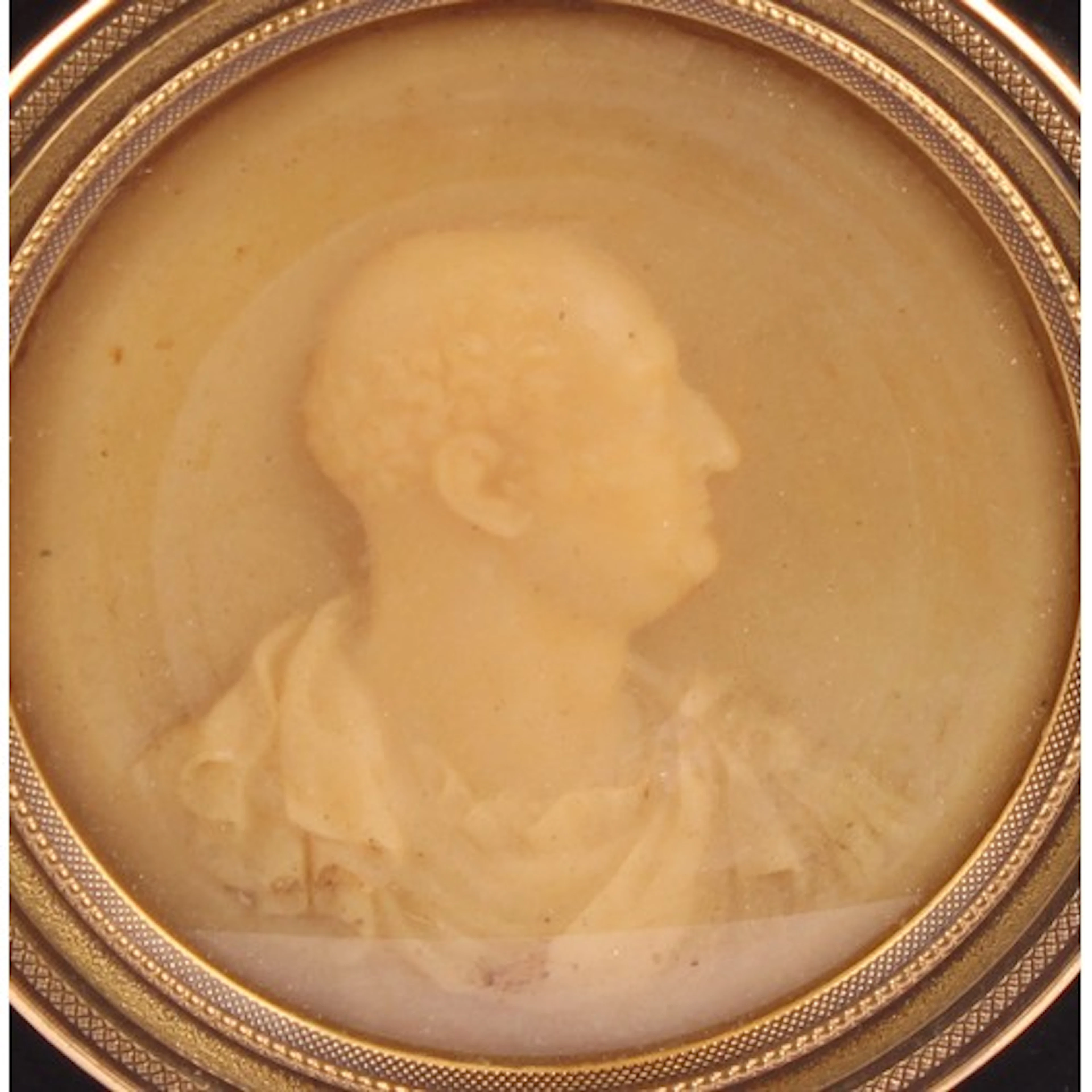 An 18th century wax portrait bust, of a gentleman in Roman a...