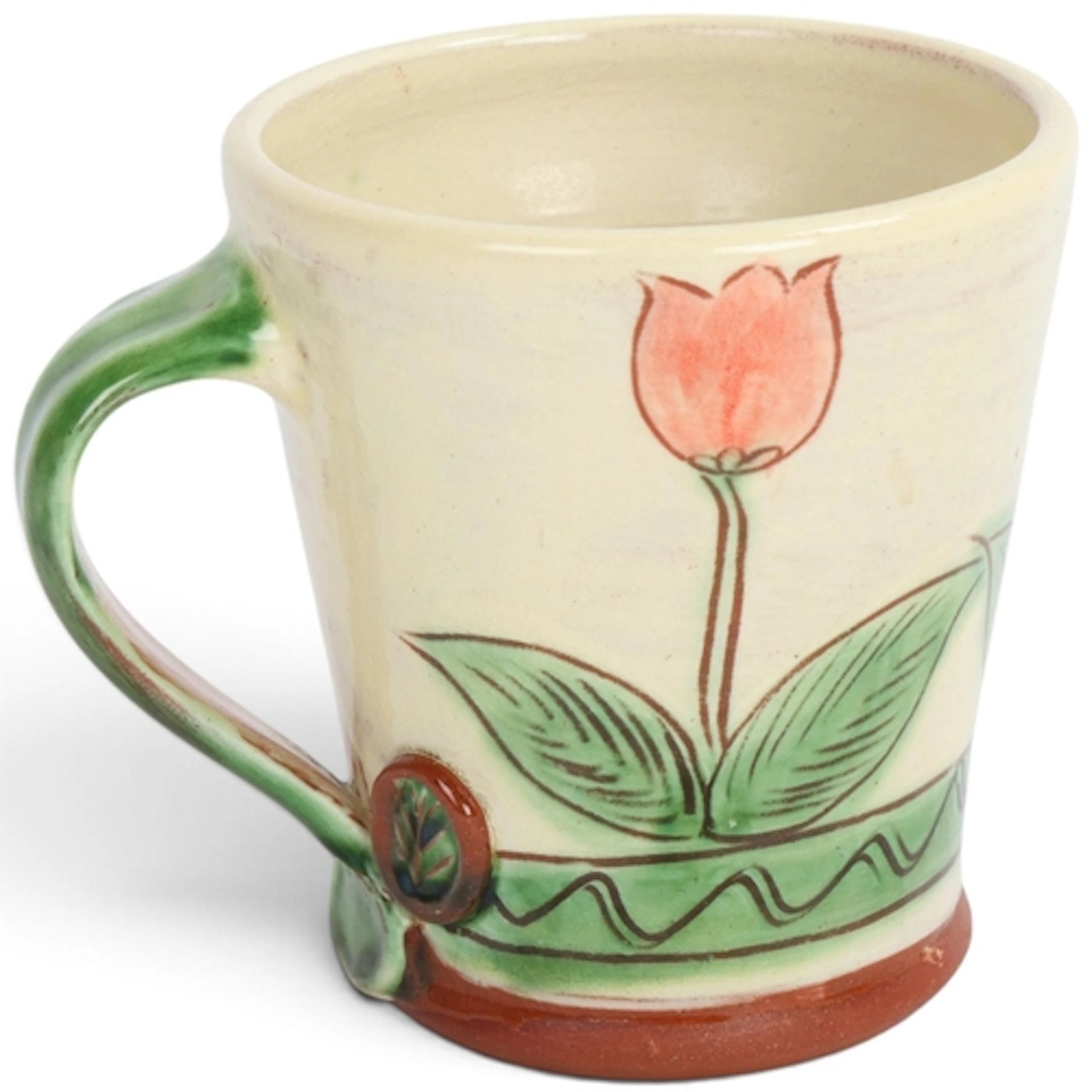 JOSIE WALTER (b.1951), an eartenware mug with slipware tulip...