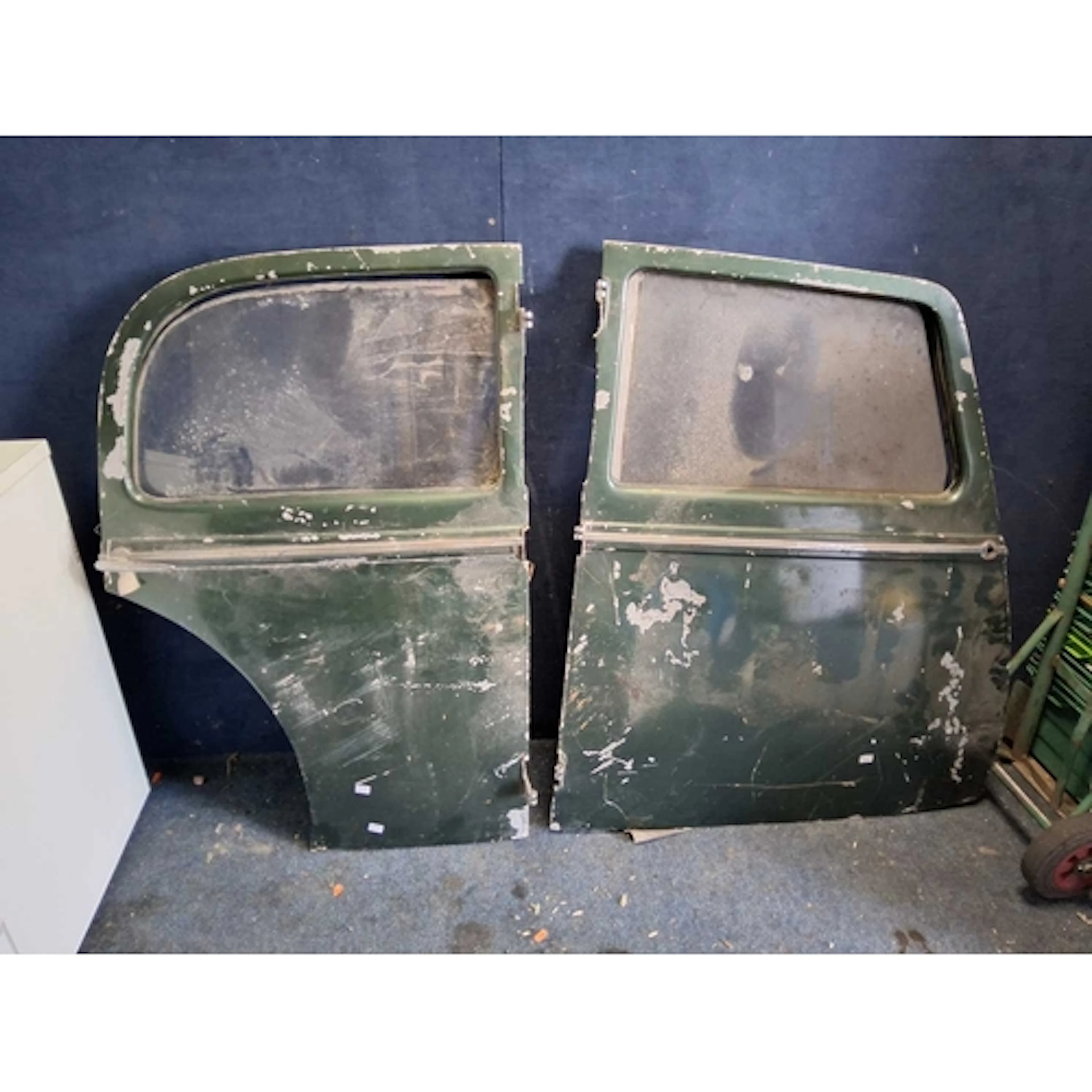 A SET OF FOUR DOORS FOR A 1950s CAR including two front 'sui...