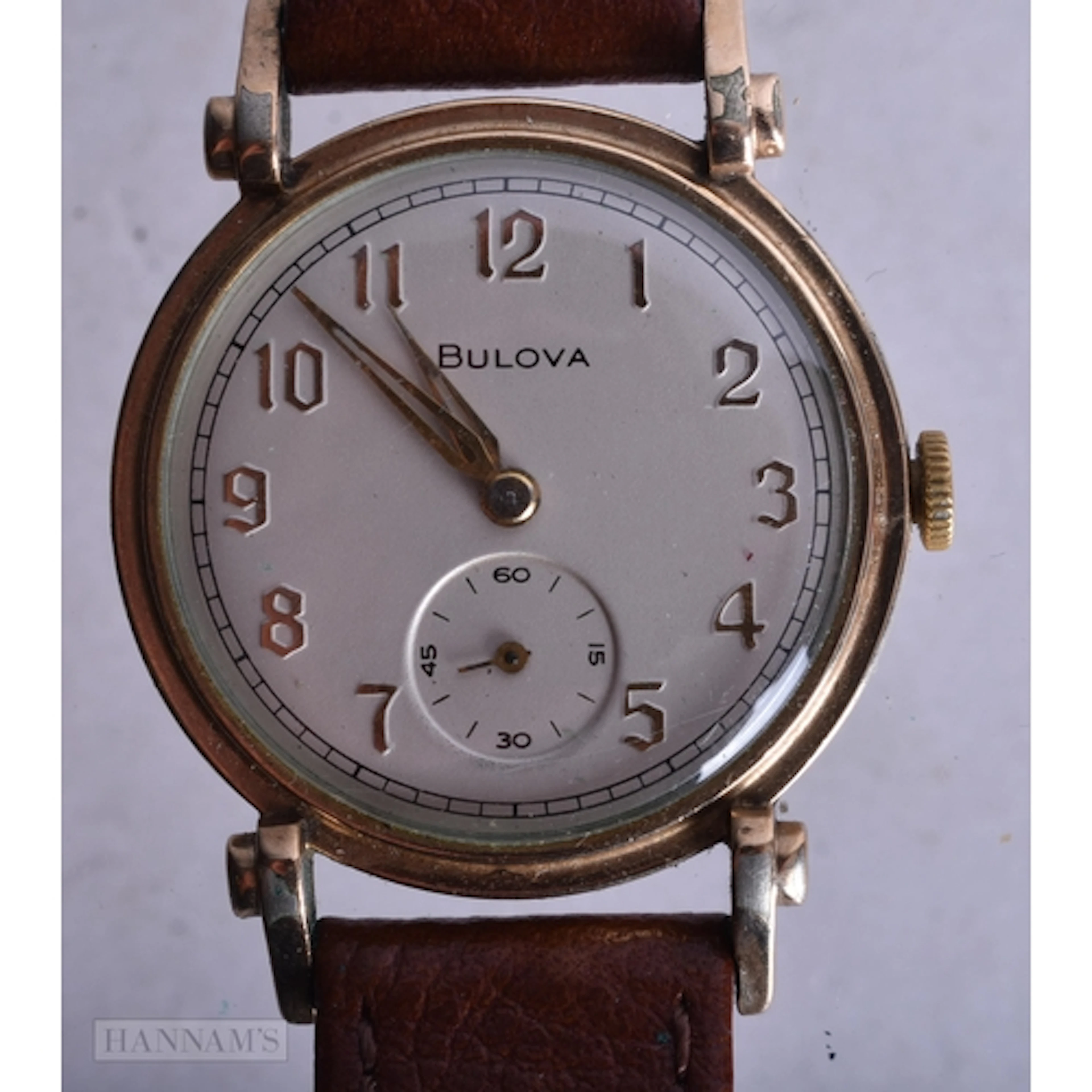 A BULOVA WRIST WATCH. Running. 3 cm wide.