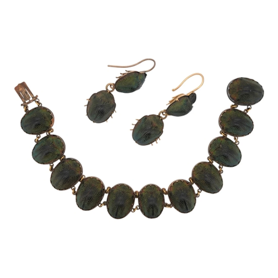 An early 20th century yellow metal mounted scarab bracelet, ...