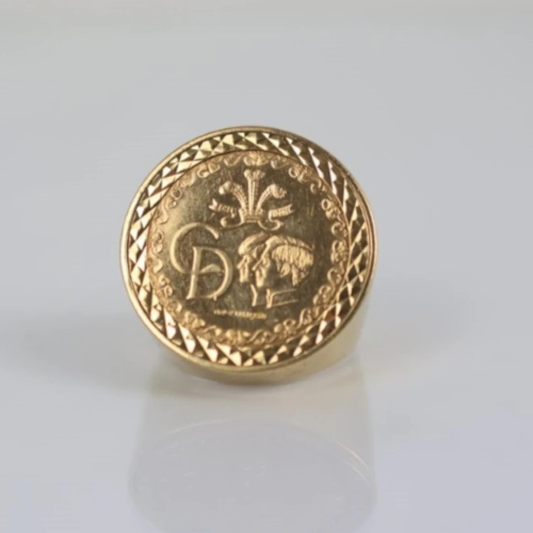 A late 20th century commemorative coin mounted ring, the 9ct...