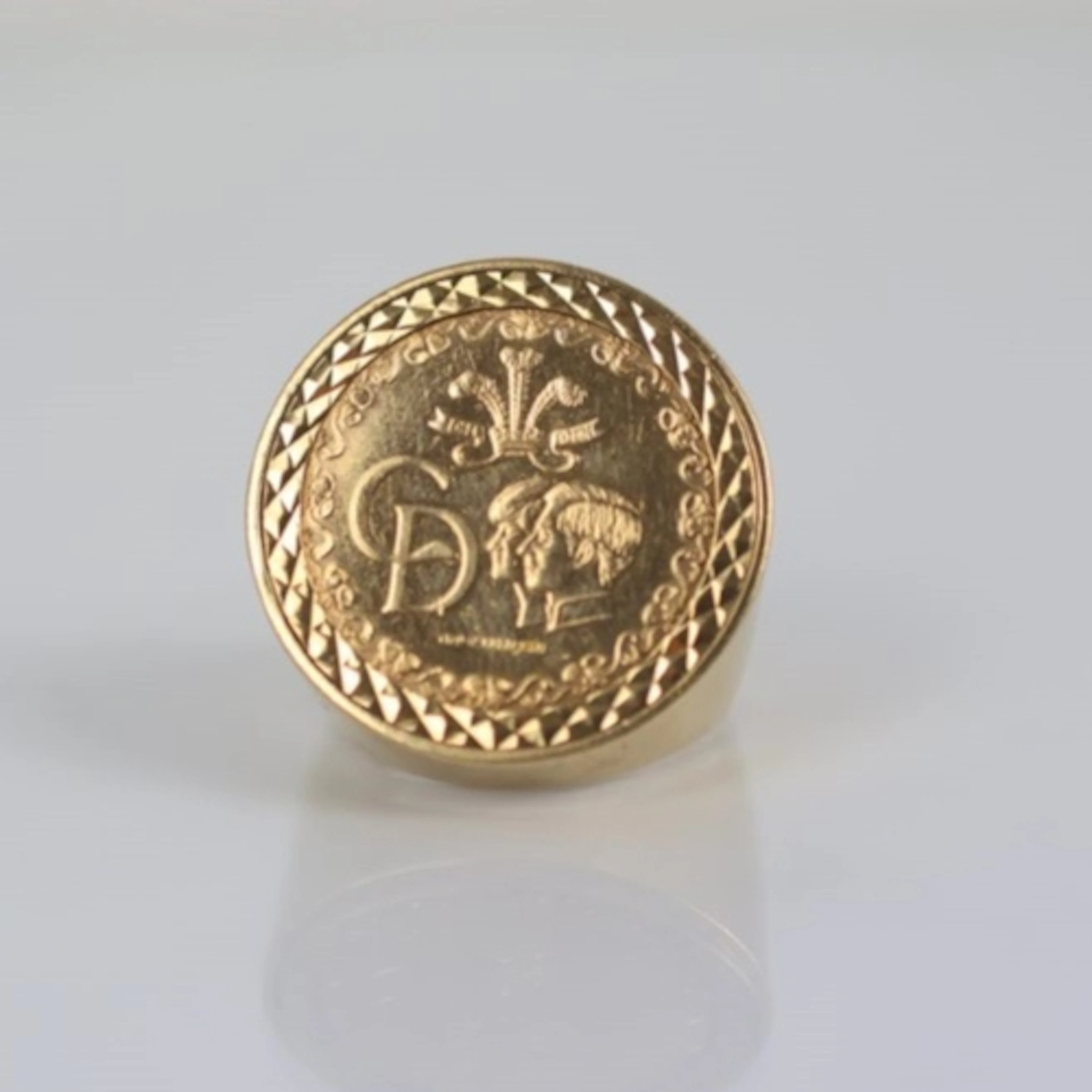 A late 20th century commemorative coin mounted ring, the 9ct...