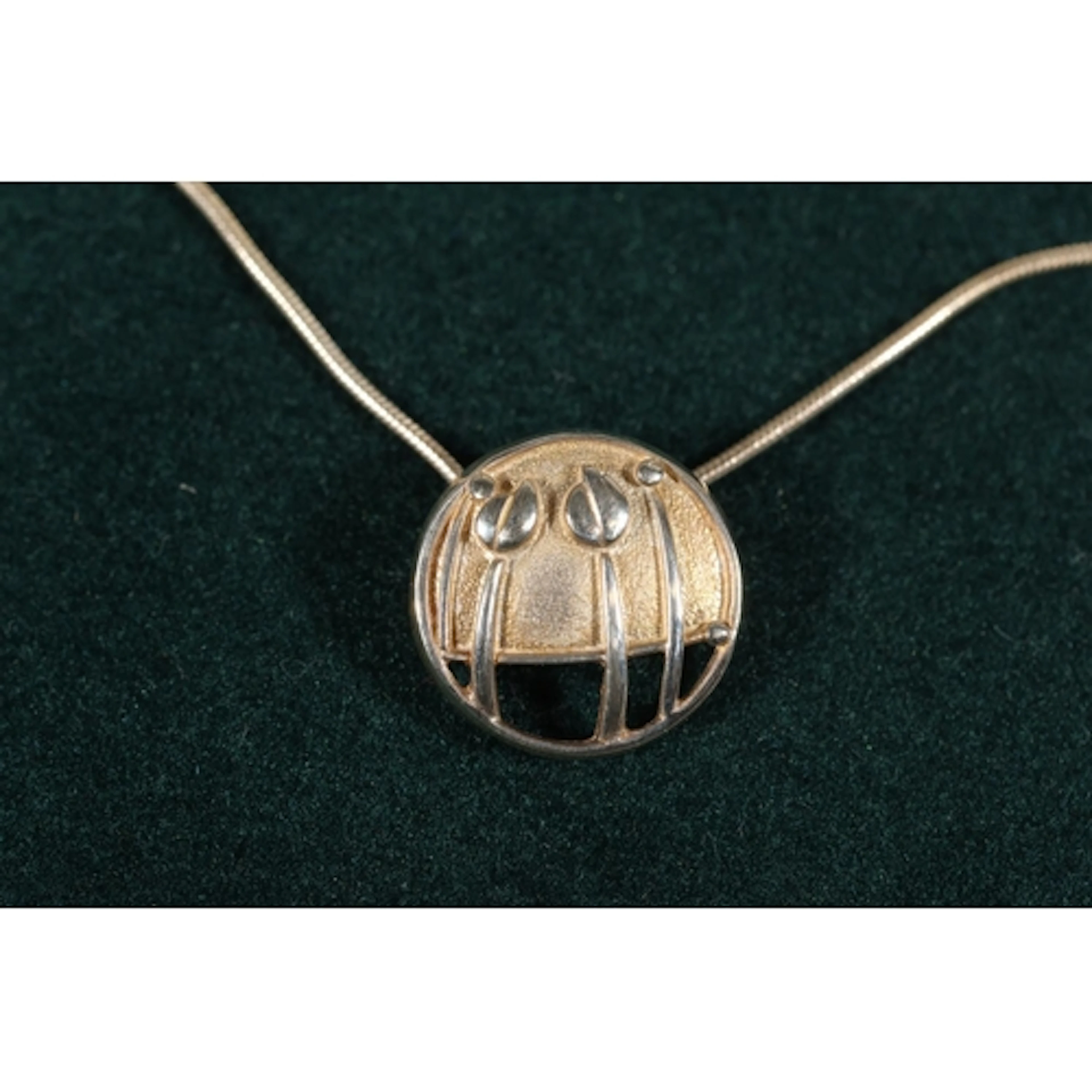 Ola Marie Gorie (Scottish b1937) of Orkney, a silver pendant...